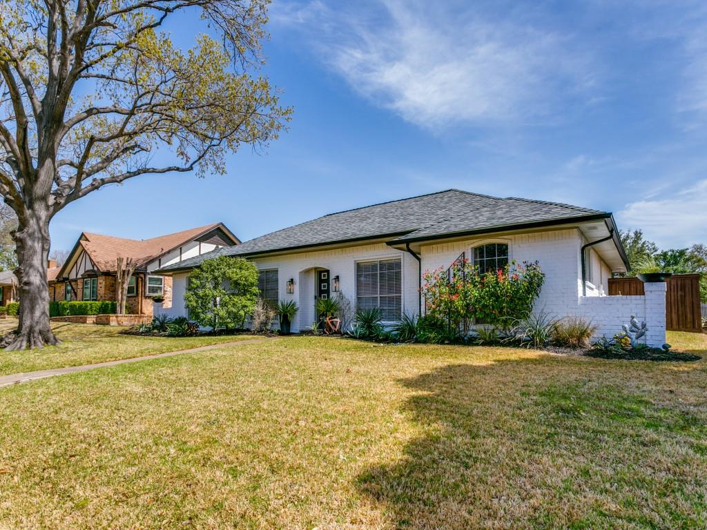 3900 Woodside Road Carrollton, TX 75007 - Photo 1 of 1 a front view of a house with a yard and garage