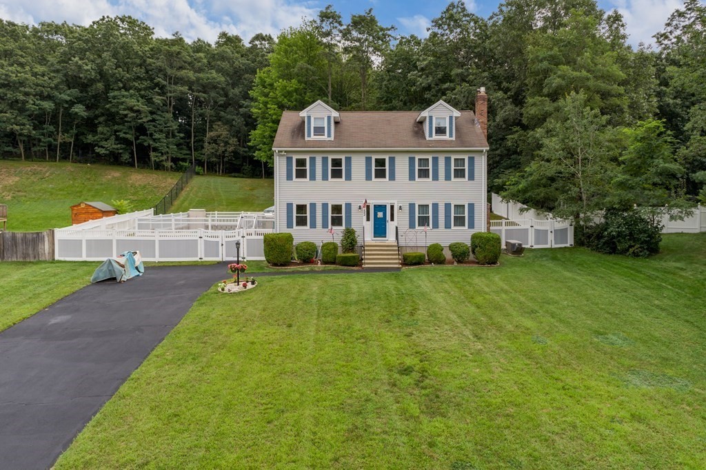 22 Stonehedge Circle Billerica, MA 01821 - Photo 1 of 30 a front view of a house with garden and trees