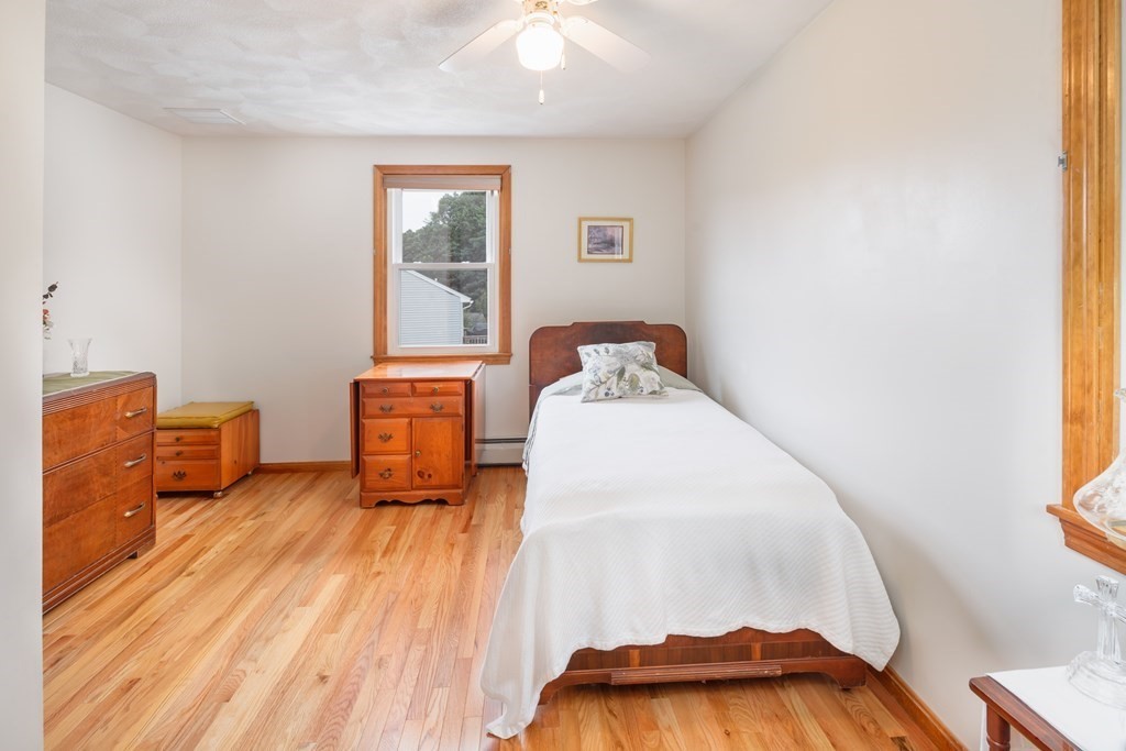 22 Stonehedge Circle Billerica, MA 01821 - Photo 13 of 30 a living room with furniture and a wooden floor