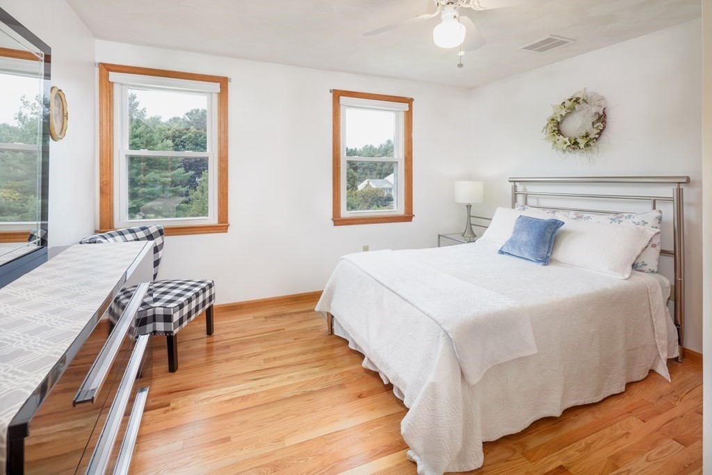 22 Stonehedge Circle Billerica, MA 01821 - Photo 15 of 30 a bedroom with a bed and a window with wooden floor