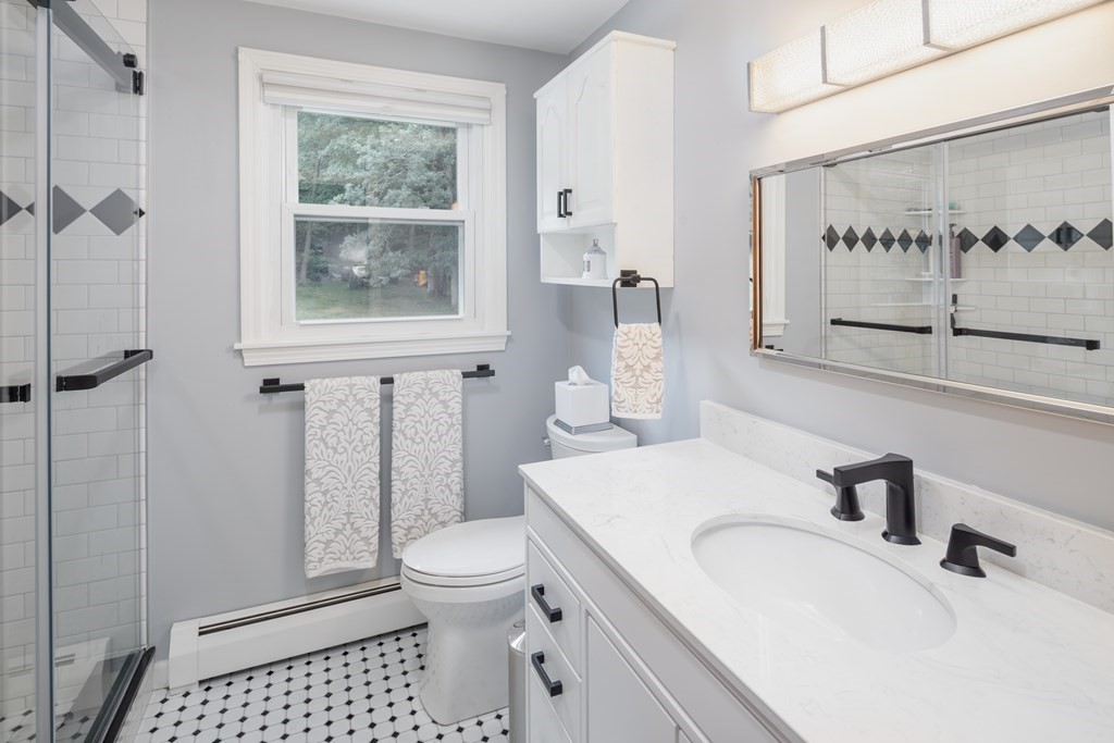 22 Stonehedge Circle Billerica, MA 01821 - Photo 17 of 30 a bathroom with a sink toilet and shower