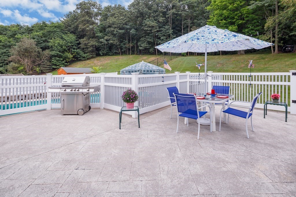 22 Stonehedge Circle Billerica, MA 01821 - Photo 18 of 30 an outdoor space with furniture and umbrella