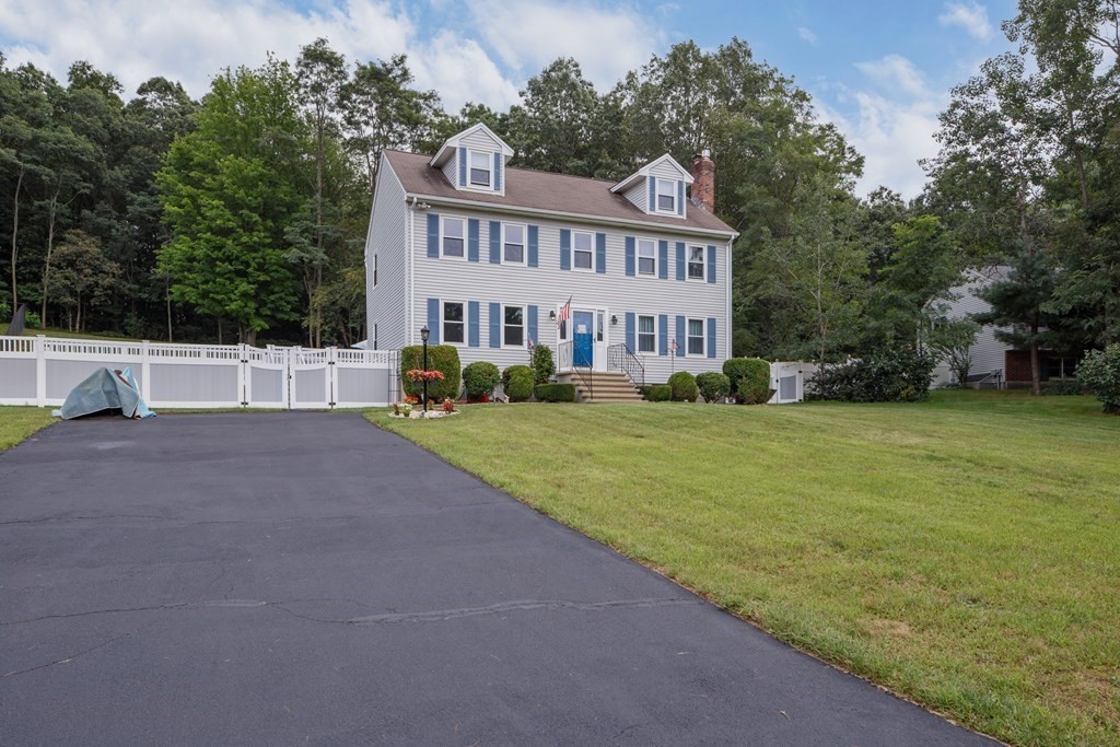 22 Stonehedge Circle Billerica, MA 01821 - Photo 24 of 30 a view of house with outdoor space and garden