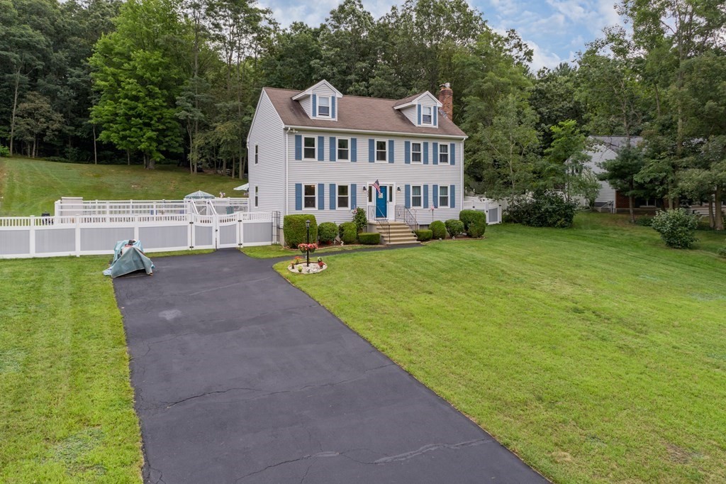22 Stonehedge Circle Billerica, MA 01821 - Photo 25 of 30 a view of a house with a yard and sitting area