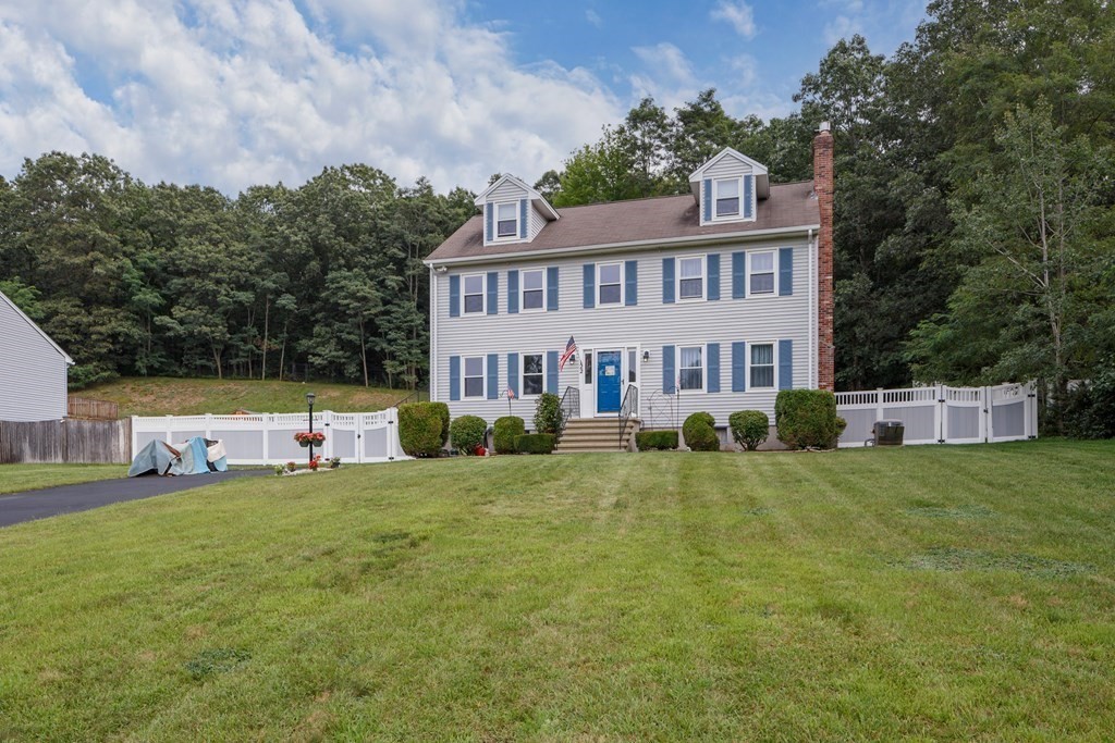 22 Stonehedge Circle Billerica, MA 01821 - Photo 26 of 30 a view of a house with a yard porch and sitting area