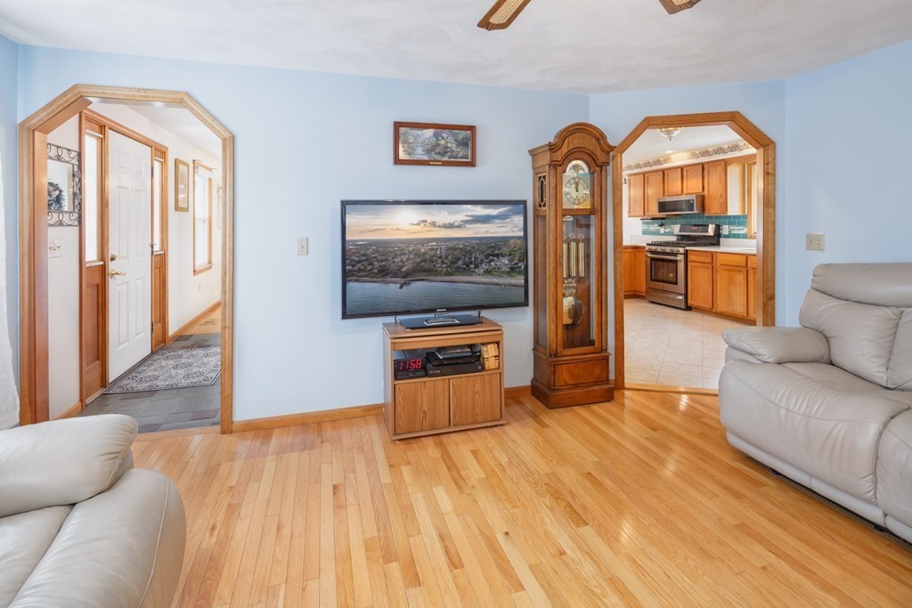 22 Stonehedge Circle Billerica, MA 01821 - Photo 3 of 30 a living room with furniture and a flat screen tv