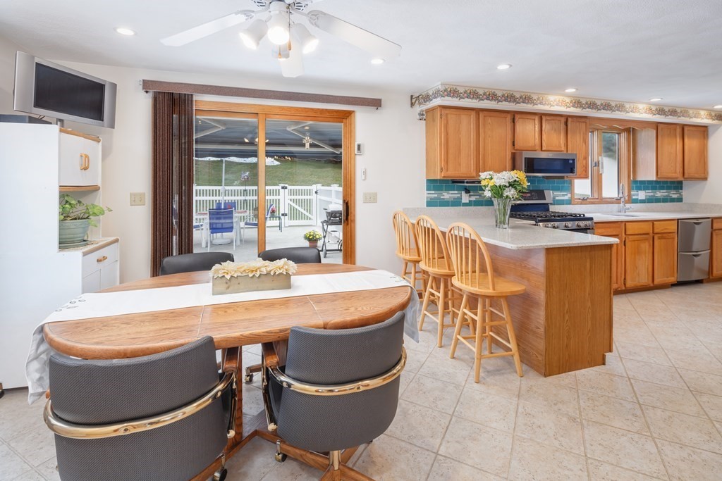 22 Stonehedge Circle Billerica, MA 01821 - Photo 7 of 30 a dining table with chairs and window