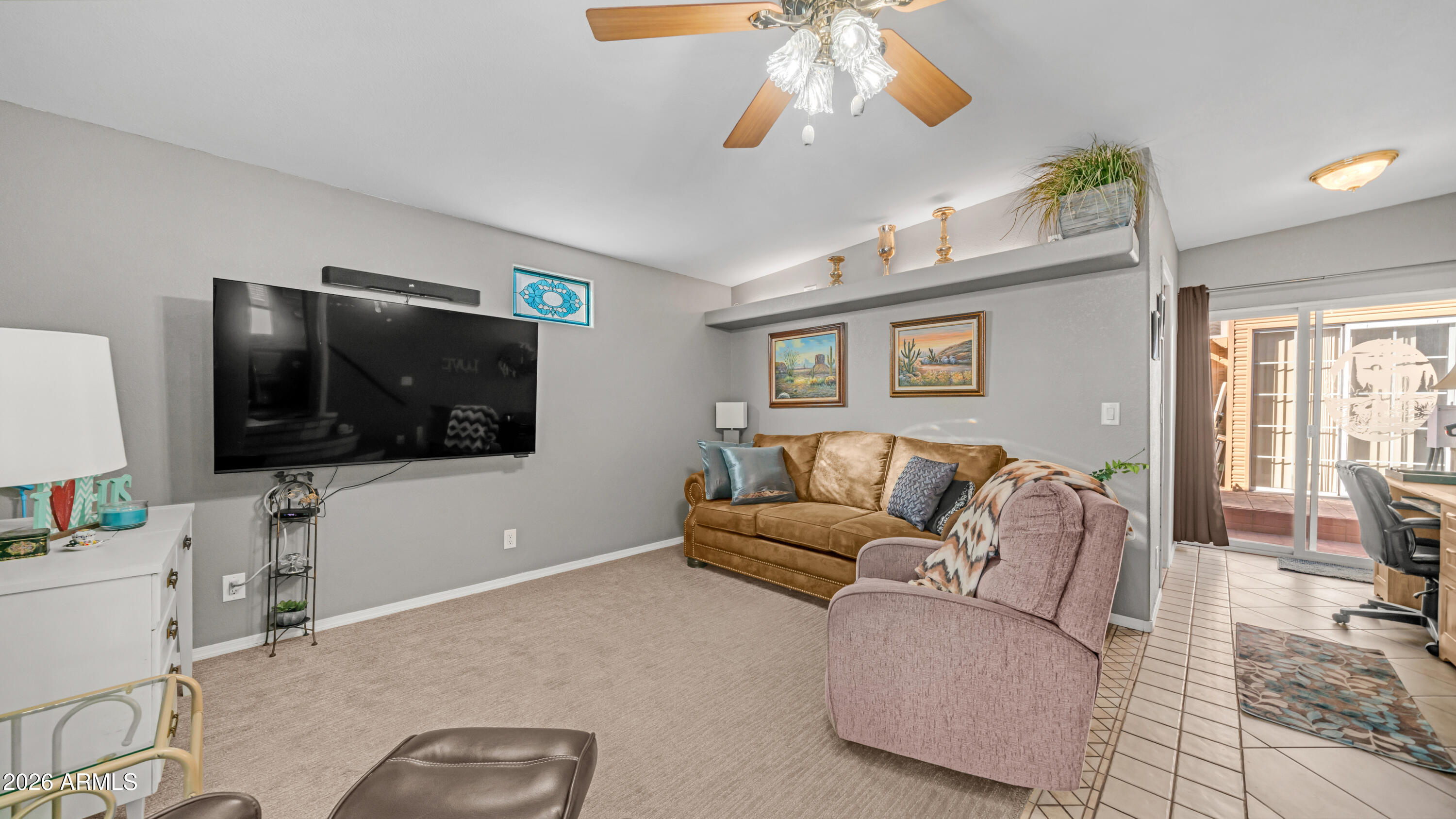 698 Felspar Drive, Unit 698 Apache Junction, AZ 85119 - Photo 1 of 62 a living room with furniture and a flat screen tv