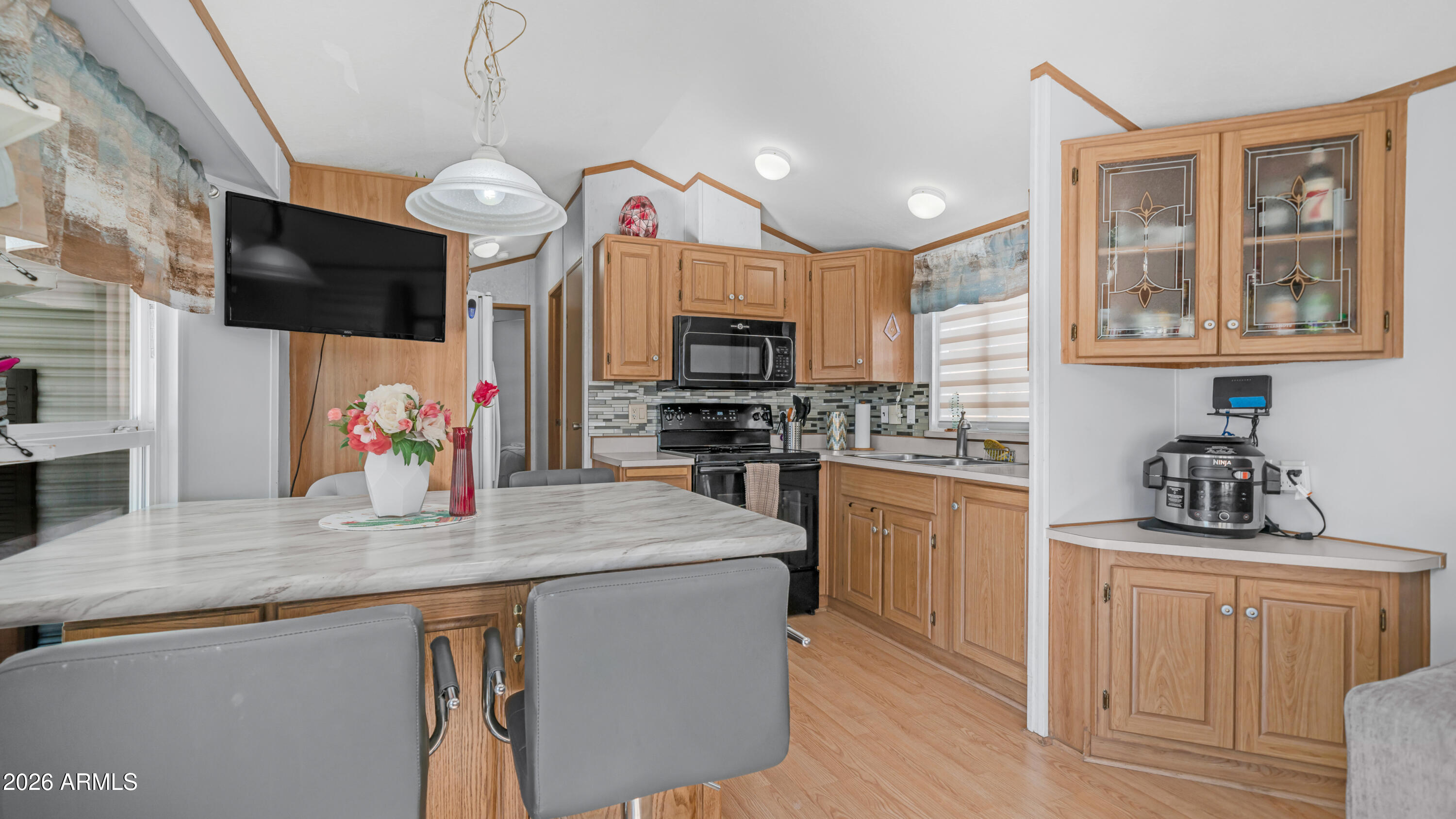 698 Felspar Drive, Unit 698 Apache Junction, AZ 85119 - Photo 11 of 62 a kitchen with stainless steel appliances granite countertop a stove and a sink