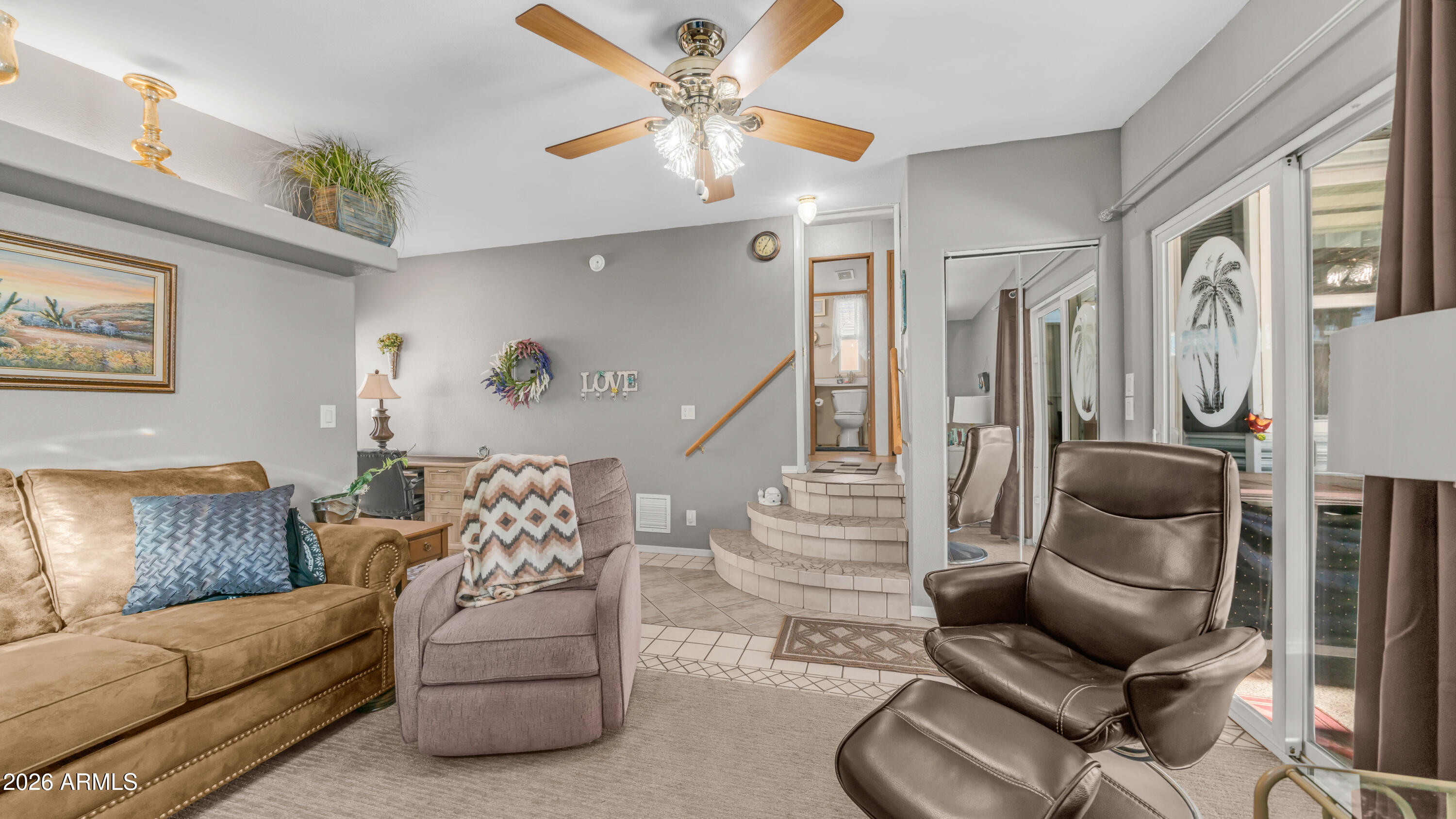 698 Felspar Drive, Unit 698 Apache Junction, AZ 85119 - Photo 22 of 62 a living room with furniture and a ceiling fan