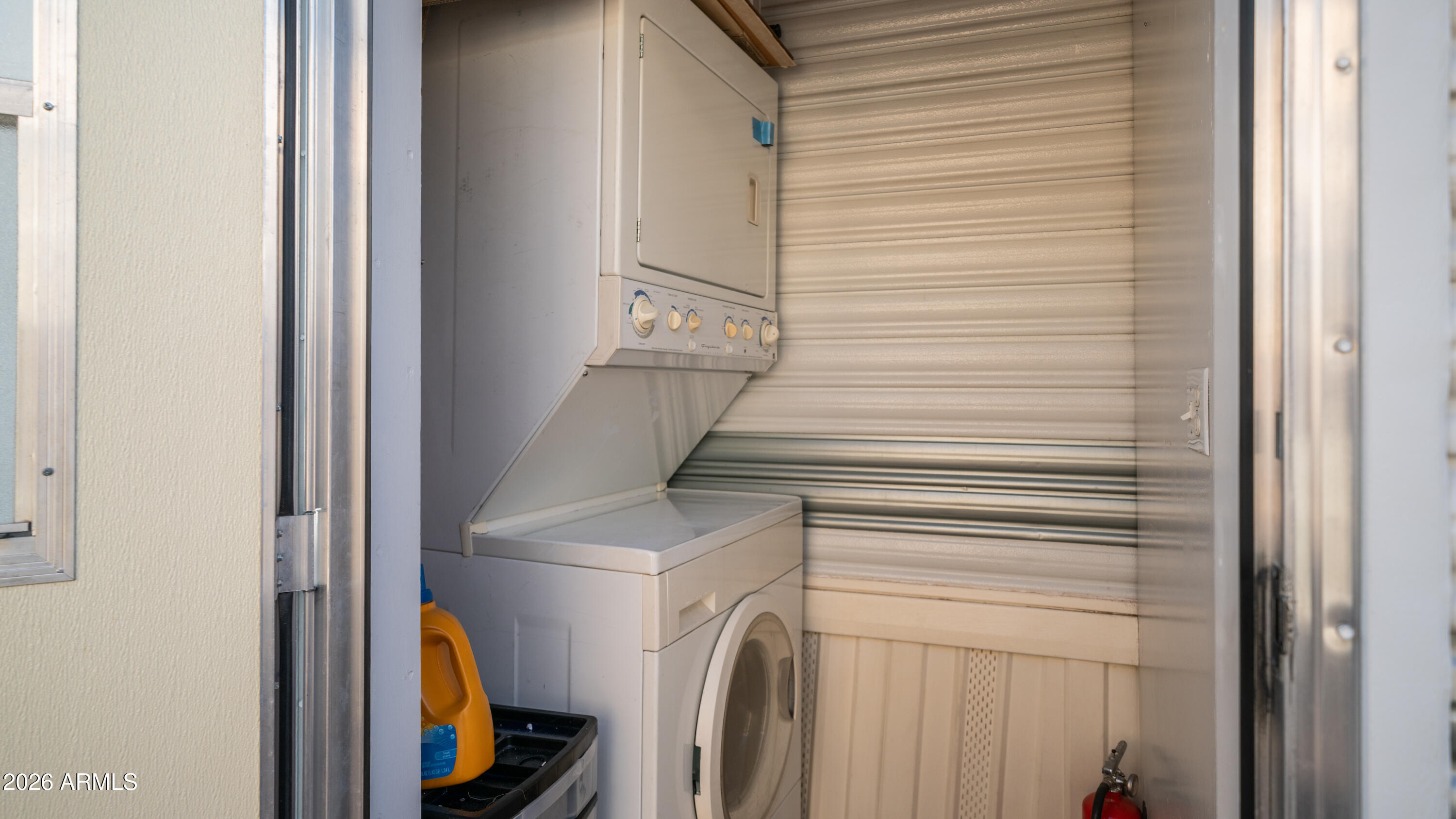 698 Felspar Drive, Unit 698 Apache Junction, AZ 85119 - Photo 30 of 62 a utility room with dryer and washer
