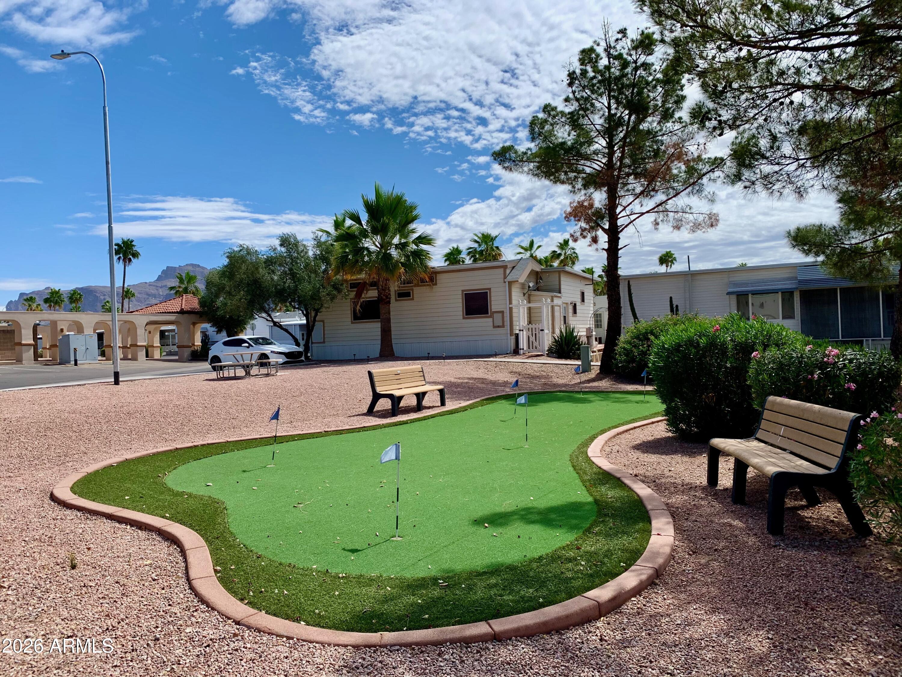 698 Felspar Drive, Unit 698 Apache Junction, AZ 85119 - Photo 44 of 62 a view of a backyard with a patio