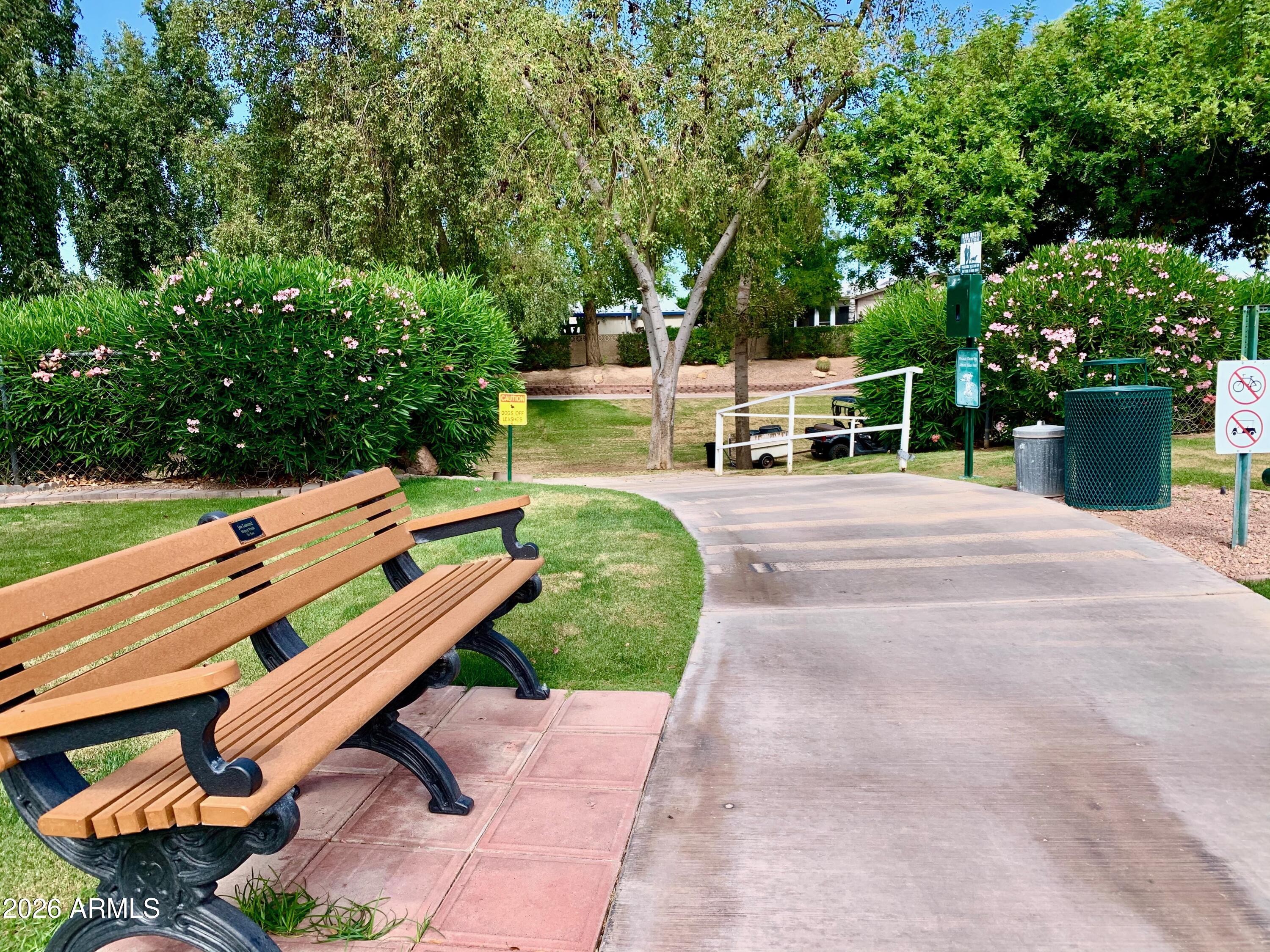 698 Felspar Drive, Unit 698 Apache Junction, AZ 85119 - Photo 57 of 62 a backyard of a house with yard and outdoor seating