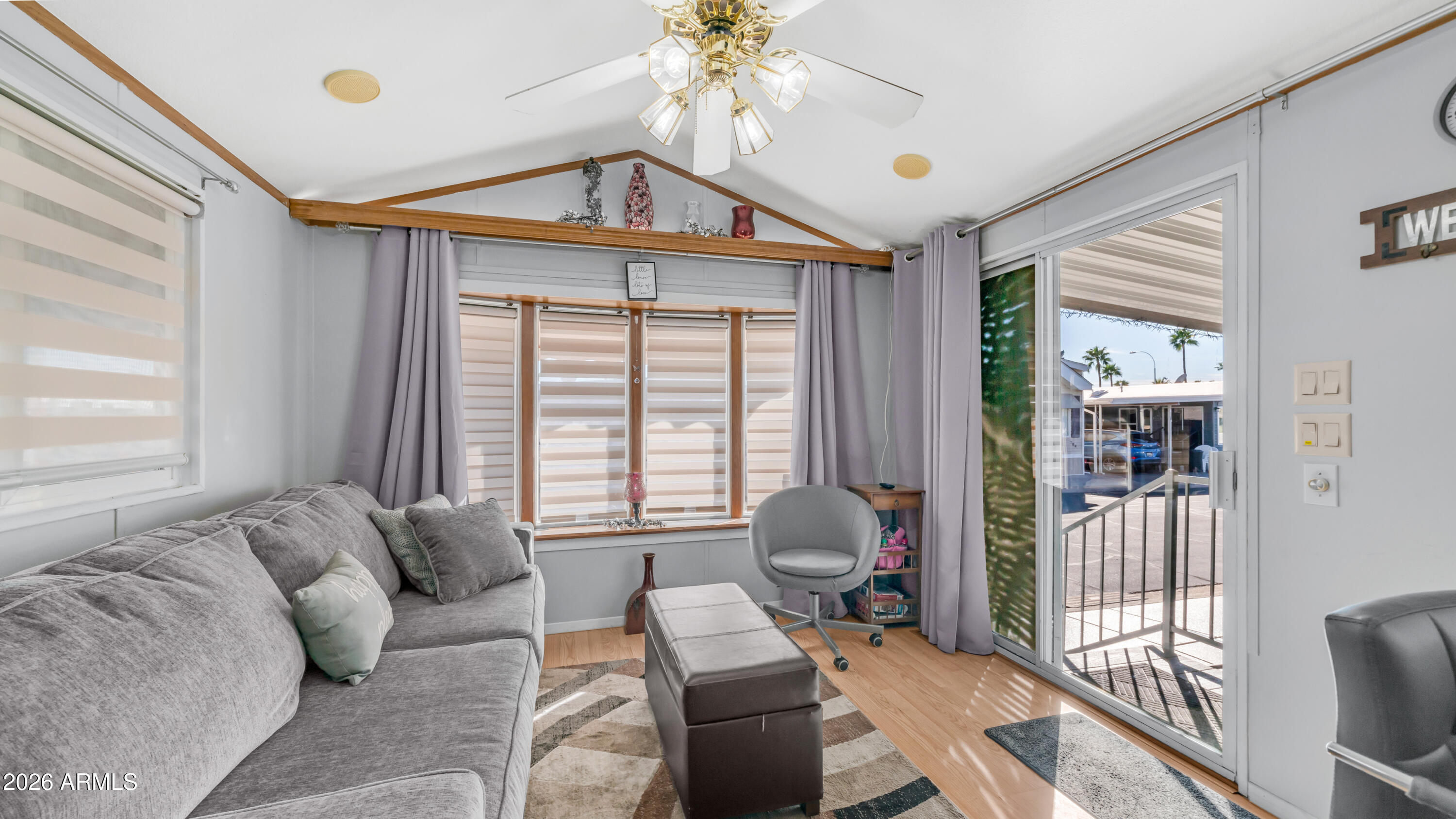 698 Felspar Drive, Unit 698 Apache Junction, AZ 85119 - Photo 8 of 62 a living room with furniture and a large window
