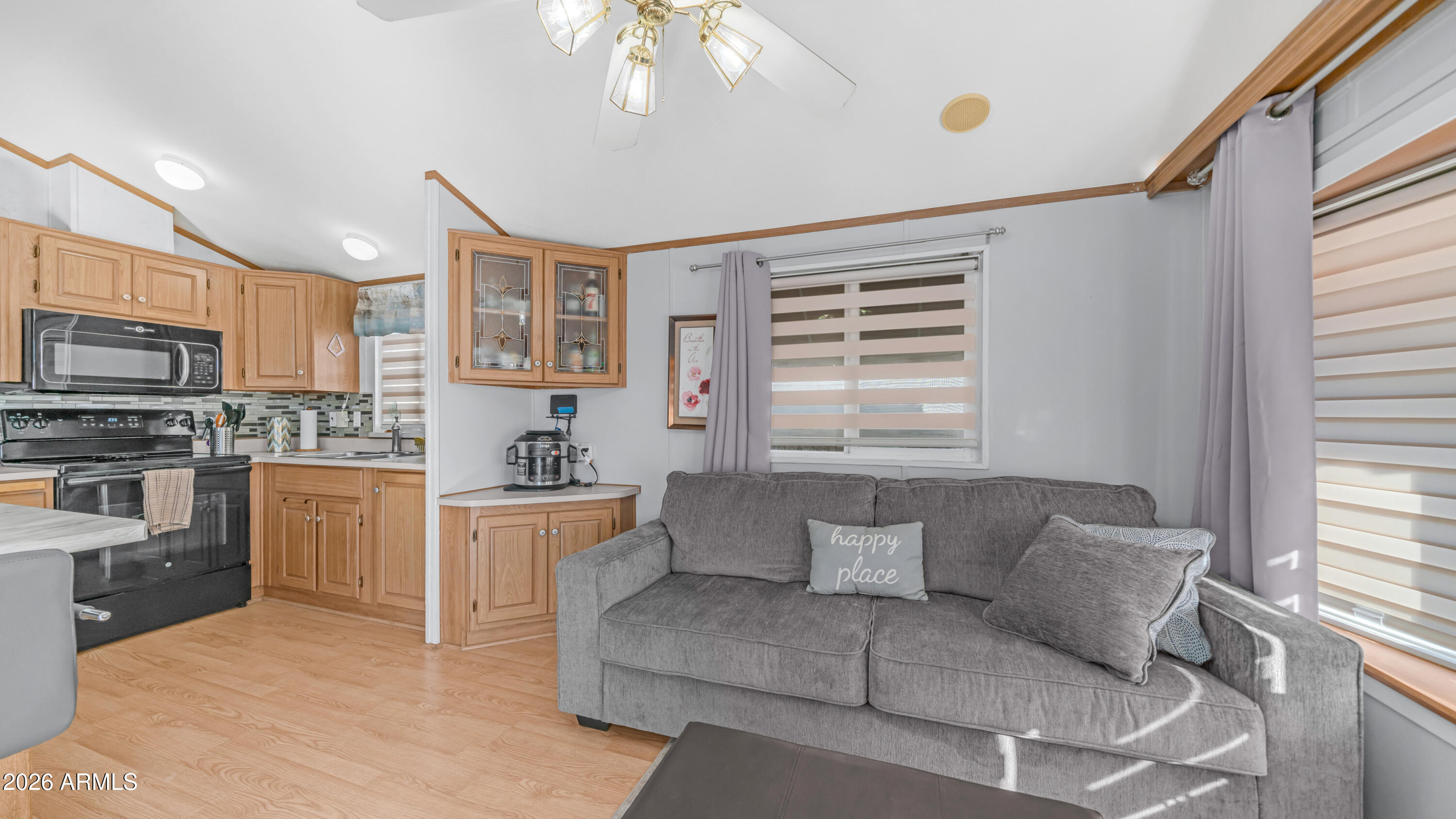 698 Felspar Drive, Unit 698 Apache Junction, AZ 85119 - Photo 10 of 62 a living room with furniture and a kitchen