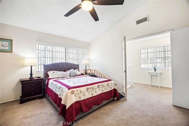a bedroom with a bed and window