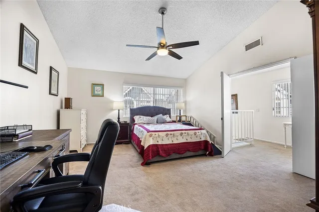 a living room with a bed furniture and a window