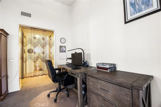 a view of a workspace with furniture