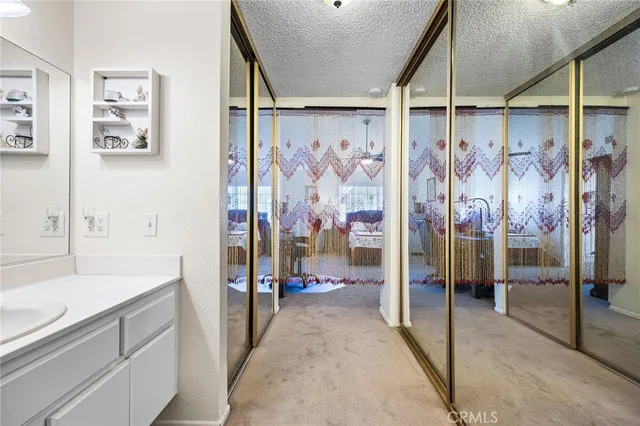 a bathroom with a shower and a sink