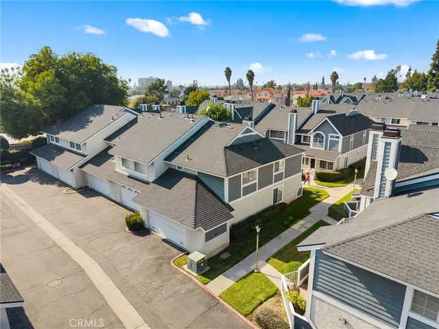 an aerial view of a house with a garden and swimming pool