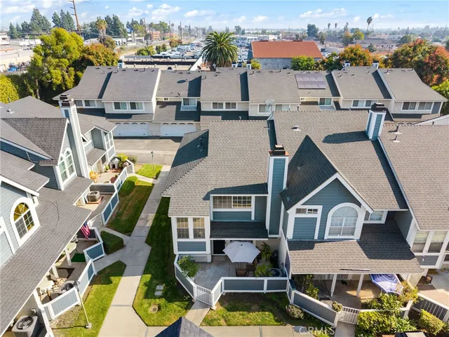 a view of a house with a backyard and a patio