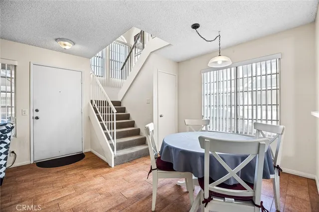 a view of a room with furniture and windows