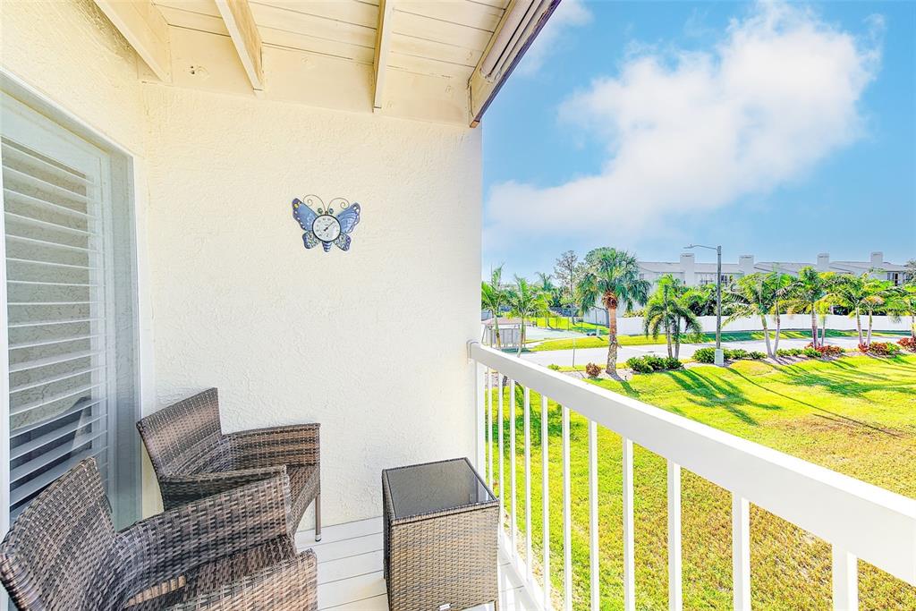 205 Marcdale Boulevard Indian Rocks Beach, FL 33785 - Photo 17 of 59 a view of balcony with furniture
