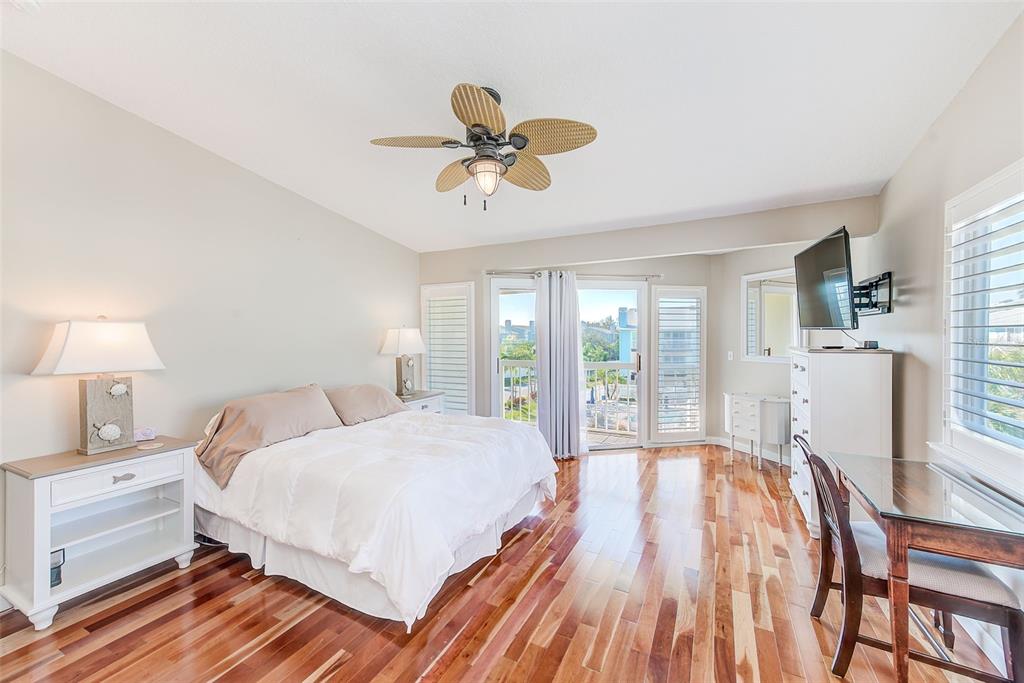 205 Marcdale Boulevard Indian Rocks Beach, FL 33785 - Photo 27 of 59 a bedroom with a bed and a window