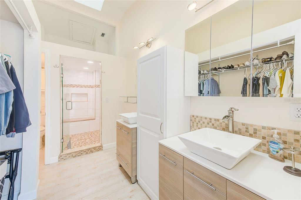 205 Marcdale Boulevard Indian Rocks Beach, FL 33785 - Photo 30 of 59 a bathroom with a sink a toilet and shower