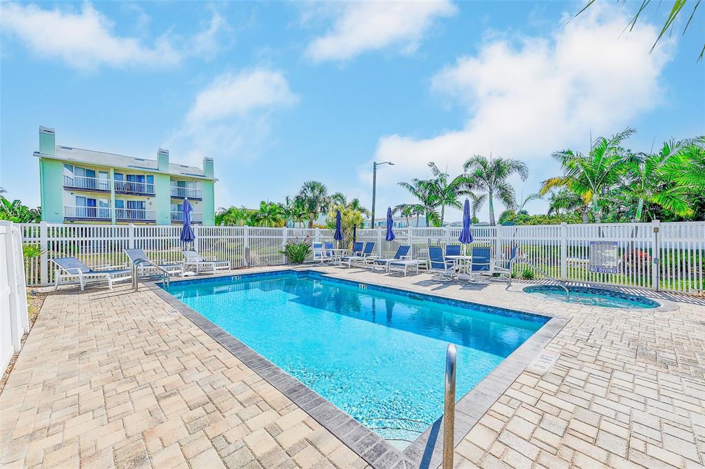 205 Marcdale Boulevard Indian Rocks Beach, FL 33785 - Photo 36 of 59 a view of swimming pool with outdoor seating and plants