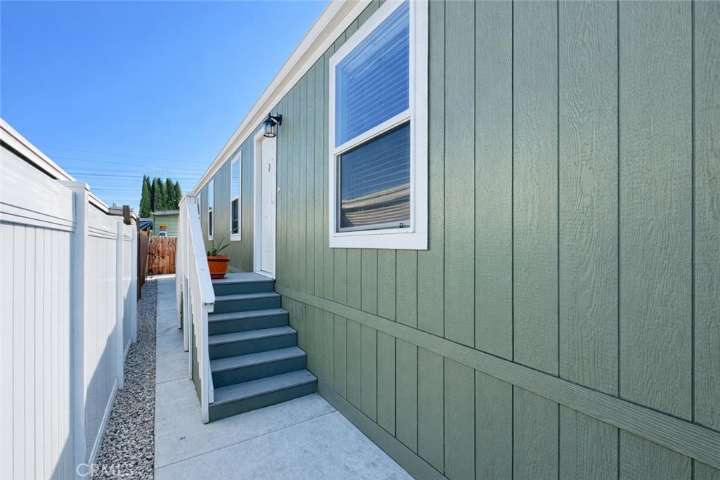 16600 Orange Avenue, Unit 130 Paramount, CA 90723 - Photo 20 of 31 a view of a house with stairs and wooden floor