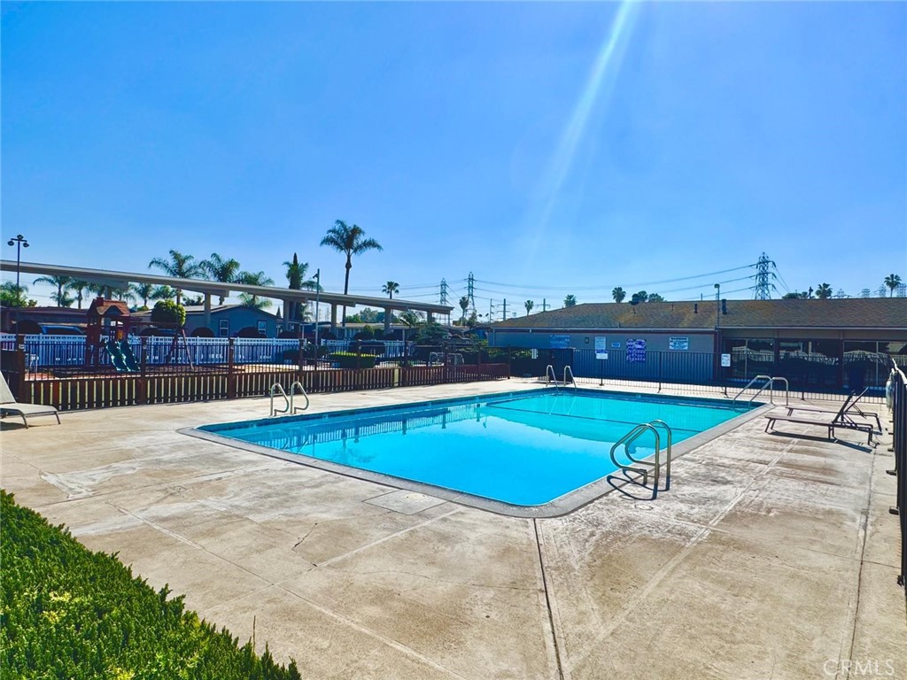 16600 Orange Avenue, Unit 130 Paramount, CA 90723 - Photo 25 of 31 a view of a swimming pool with an ocean view