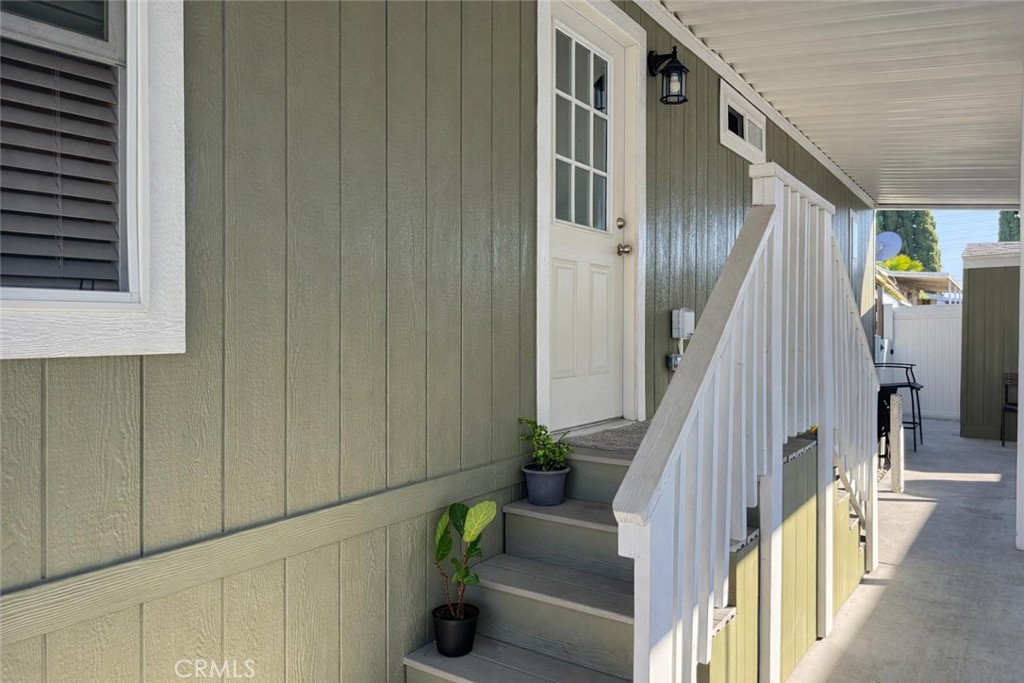 16600 Orange Avenue, Unit 130 Paramount, CA 90723 - Photo 5 of 31 a view of an entryway with wooden floor and stairs