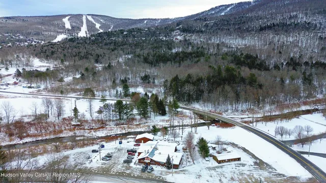 a view of a terrace with couches and dining table