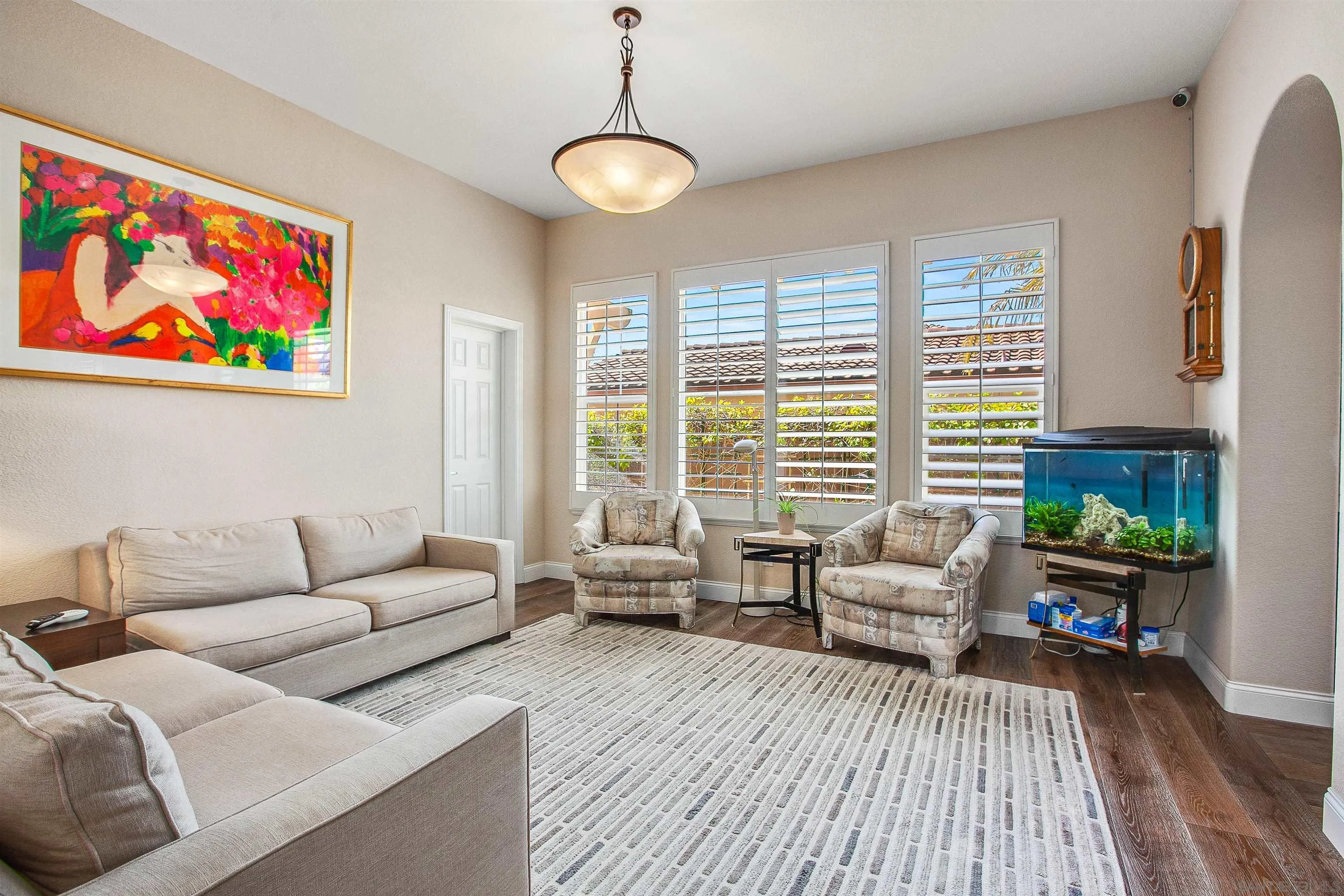 1460 Ravean Court Encinitas, CA 92024 - Photo 22 of 48 a living room with furniture and a wooden floor
