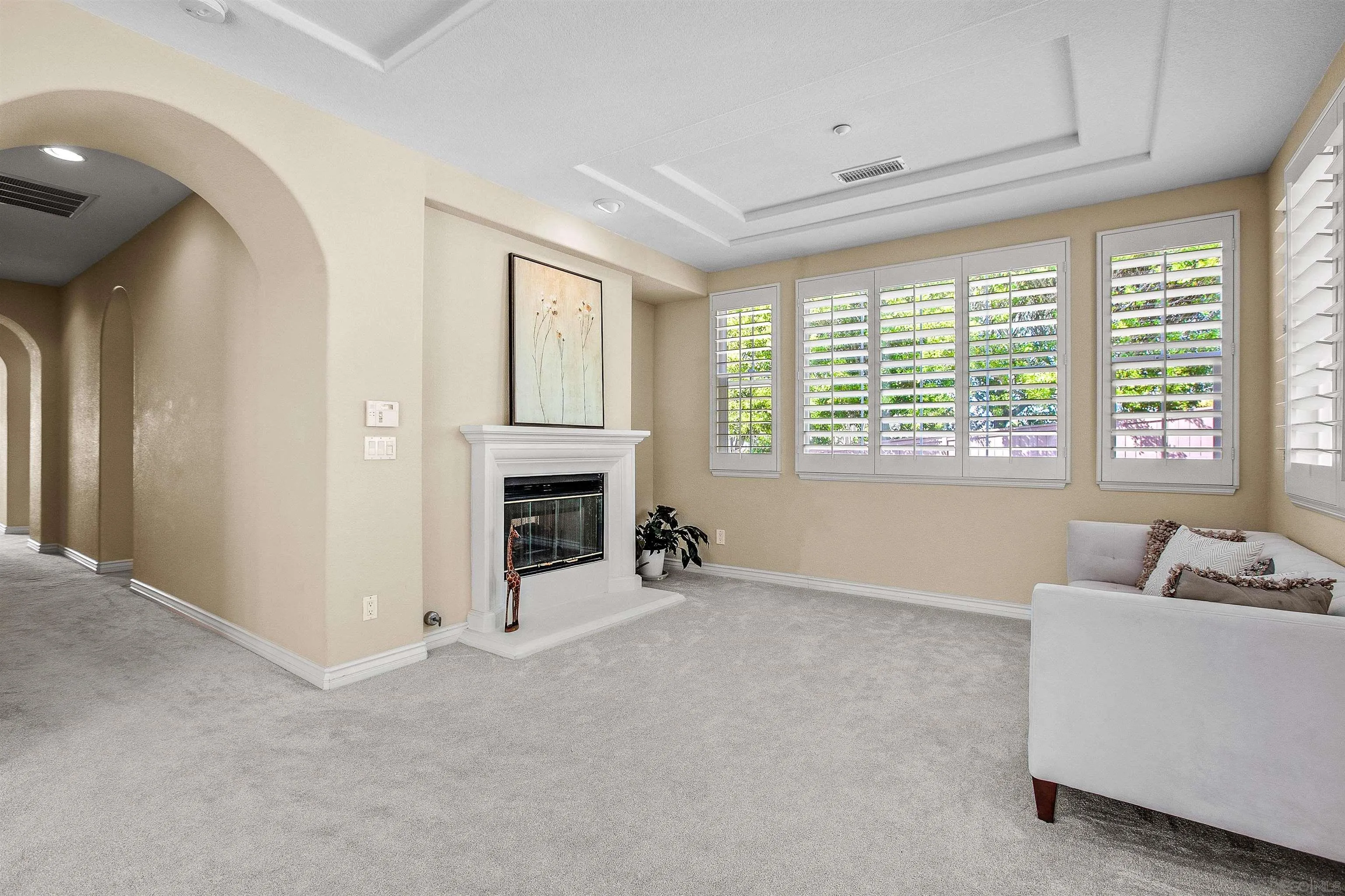 1460 Ravean Court Encinitas, CA 92024 - Photo 28 of 48 a view of an empty room with a fireplace