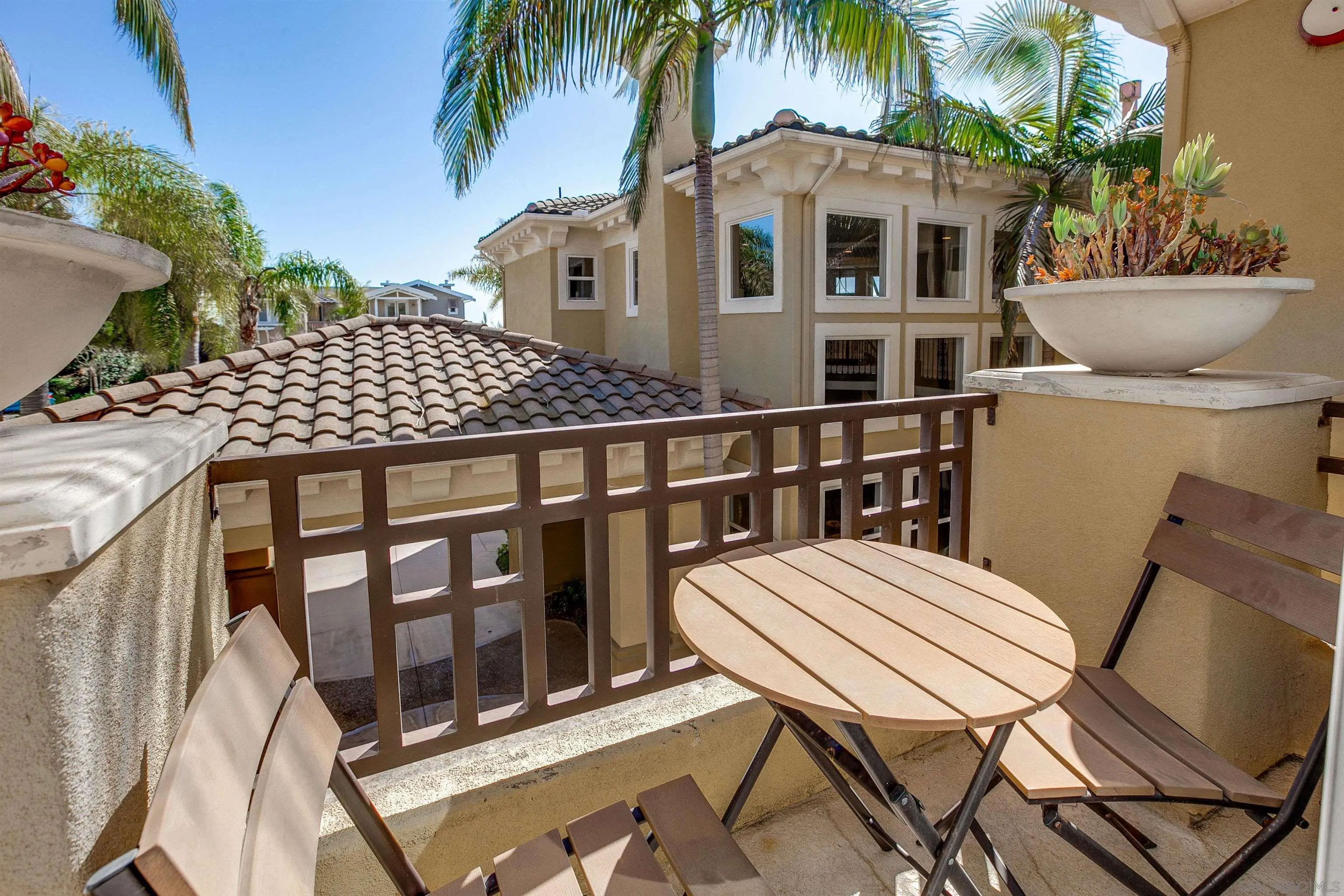 1460 Ravean Court Encinitas, CA 92024 - Photo 29 of 48 a balcony with table and chairs