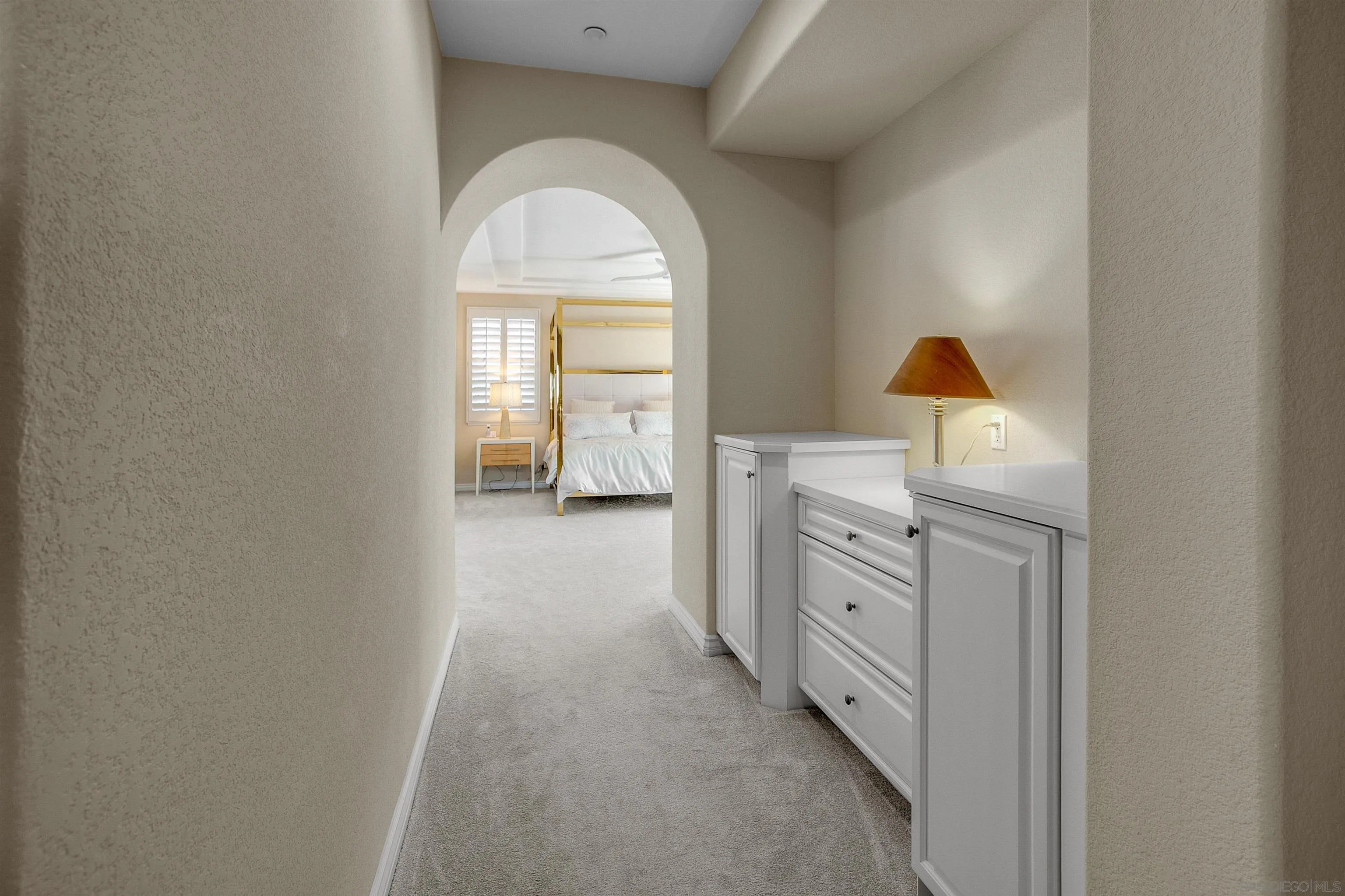 1460 Ravean Court Encinitas, CA 92024 - Photo 30 of 48 a view of a hallway to a kitchen