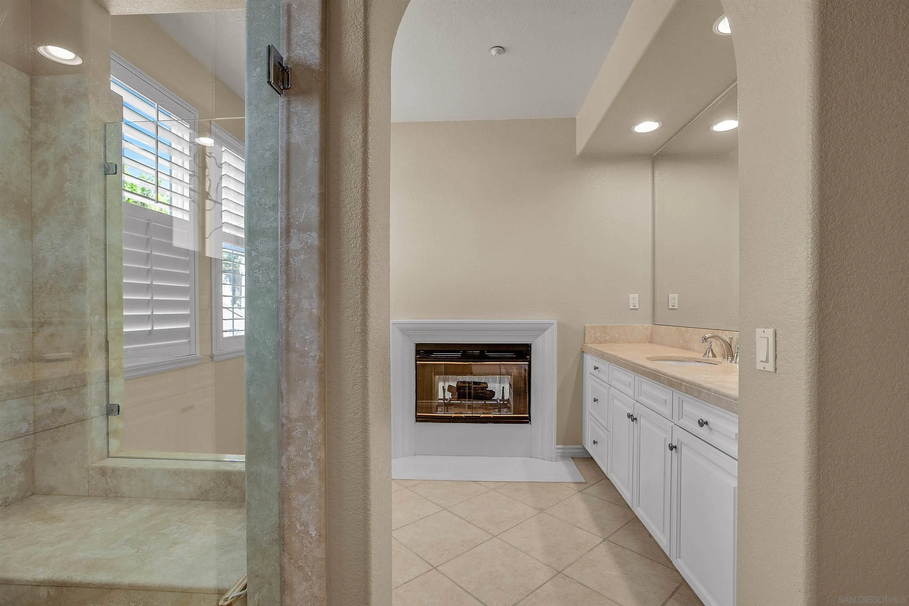 1460 Ravean Court Encinitas, CA 92024 - Photo 31 of 48 a view of an empty room and a fireplace