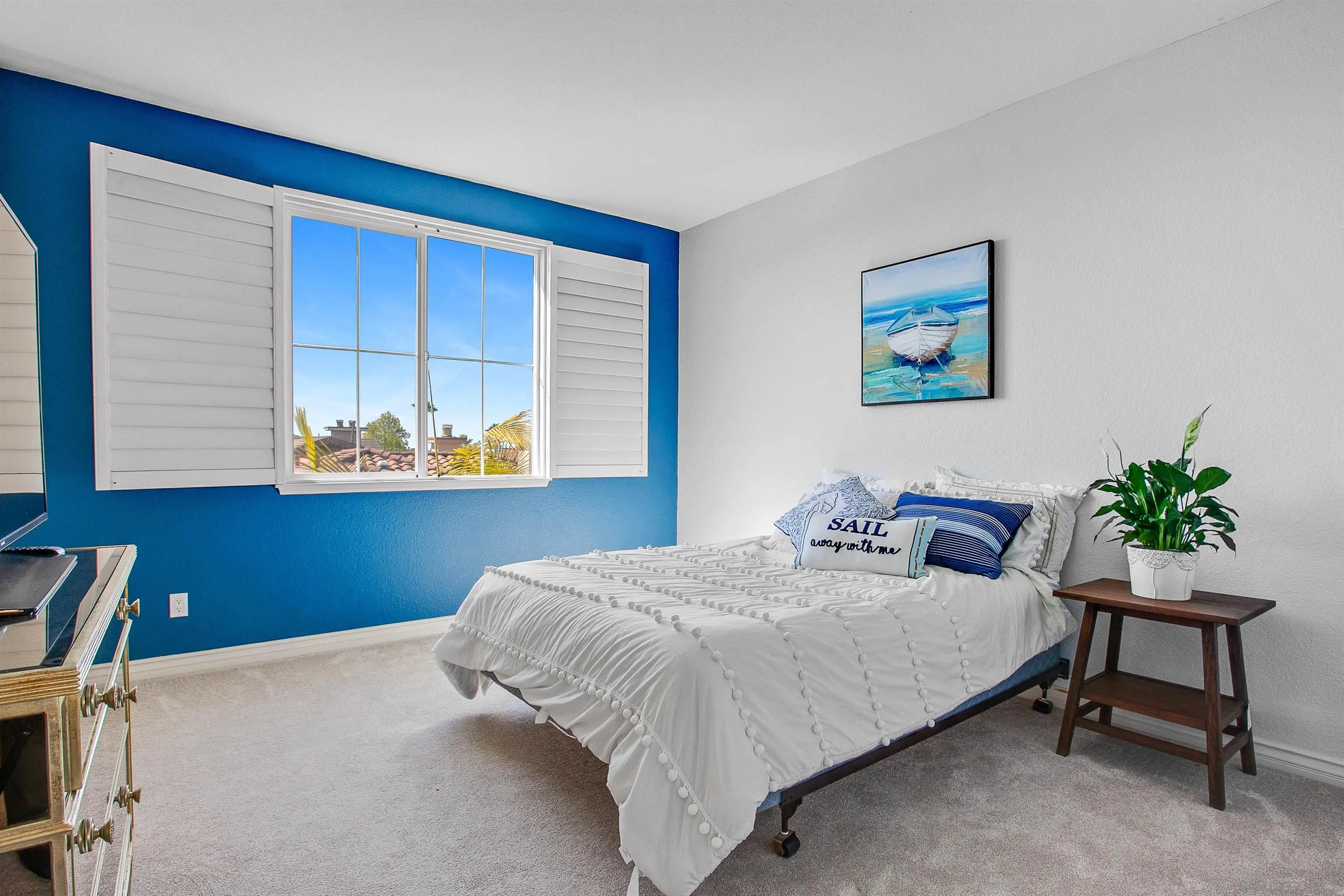 1460 Ravean Court Encinitas, CA 92024 - Photo 34 of 48 a bedroom with a bed and a painting on the wall