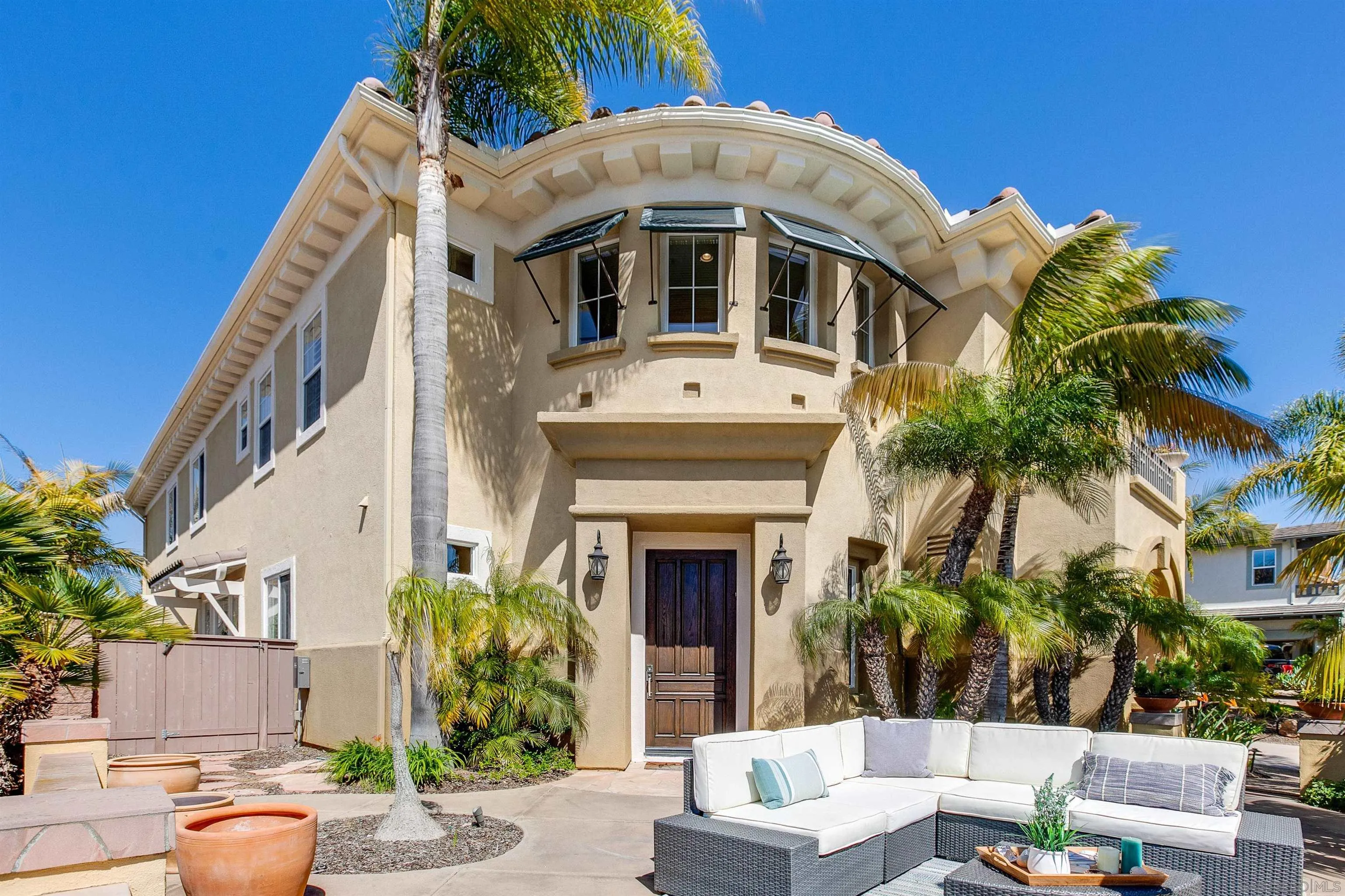 1460 Ravean Court Encinitas, CA 92024 - Photo 4 of 48 a front view of a house with a yard