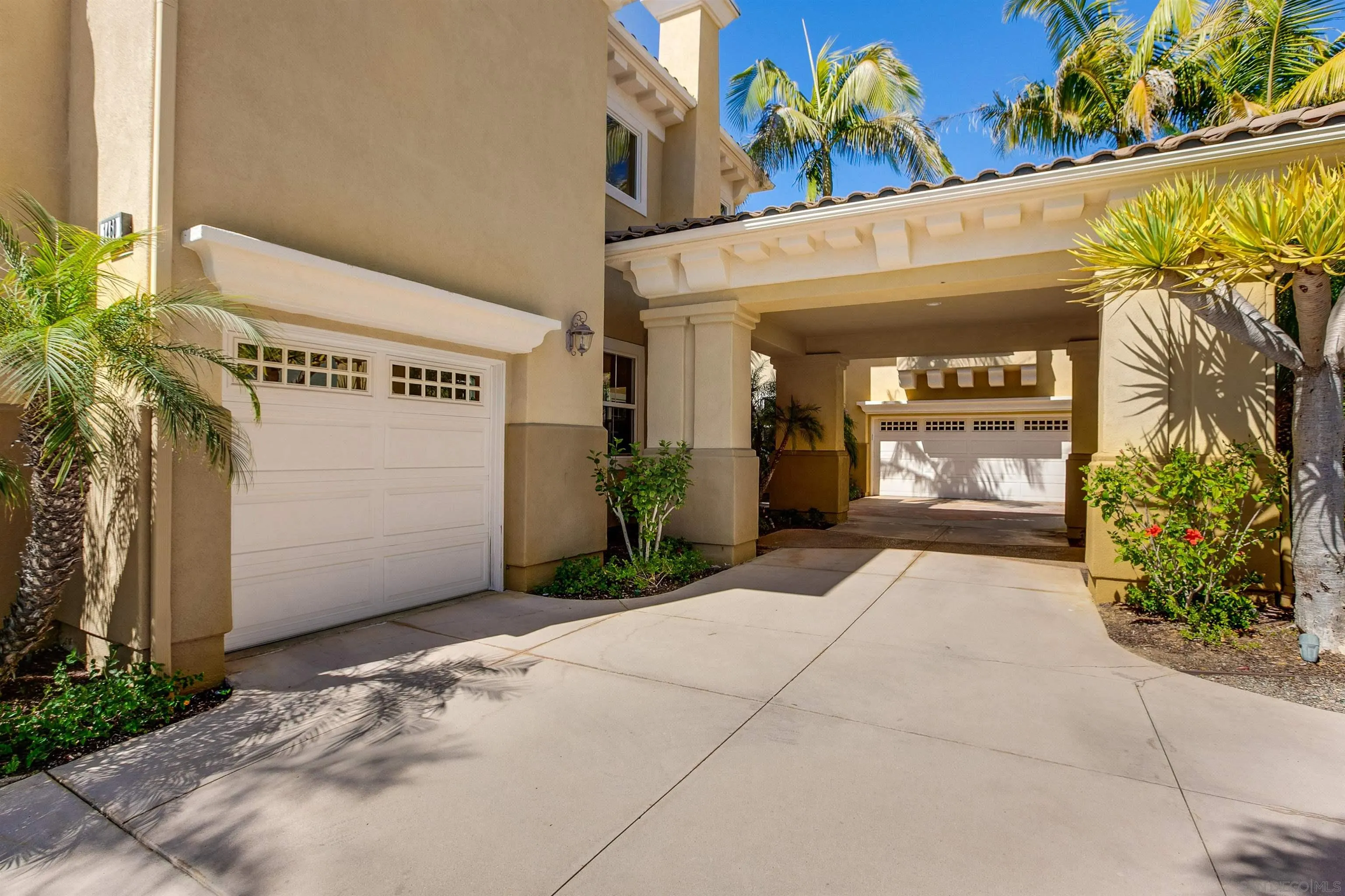 1460 Ravean Court Encinitas, CA 92024 - Photo 7 of 48 a front view of a building with potted plants