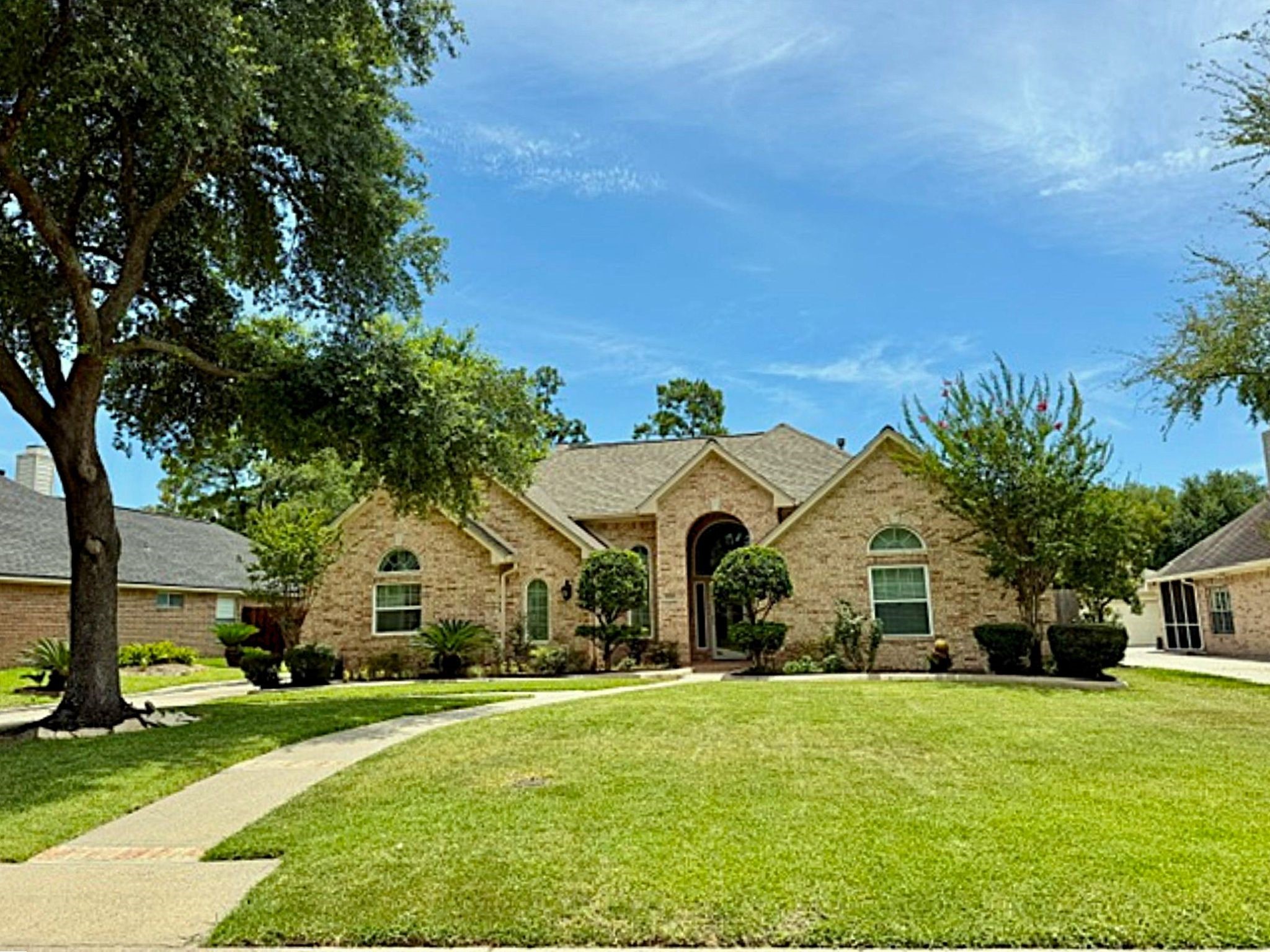 24818 Haverford Road Spring, TX 77389 - Photo 4 of 45 Brick on 4 sides, arched entryway, and lush landscaping.