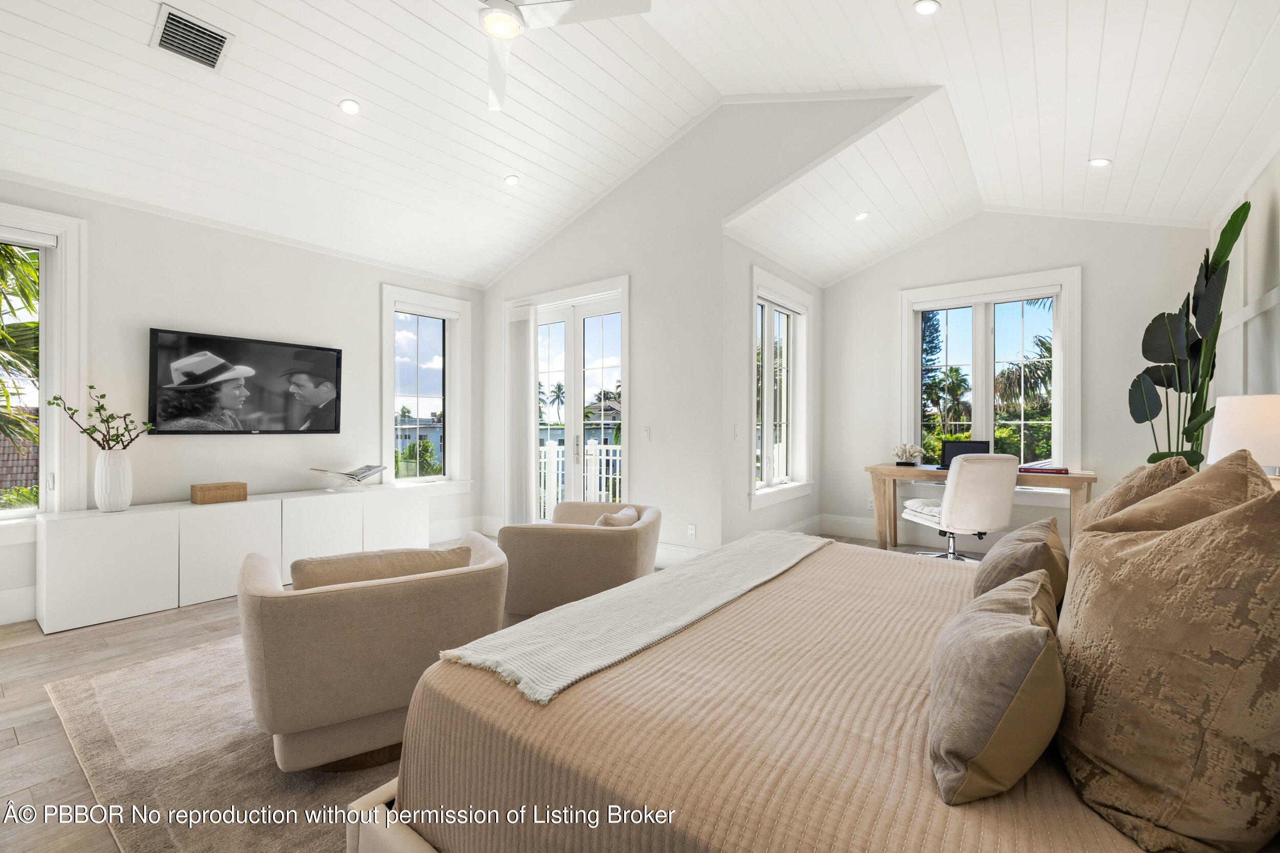 17 Adams Road, Unit 17 Ocean Ridge, FL 33435 - Photo 17 of 40 a bedroom with a bed a couch and dresser