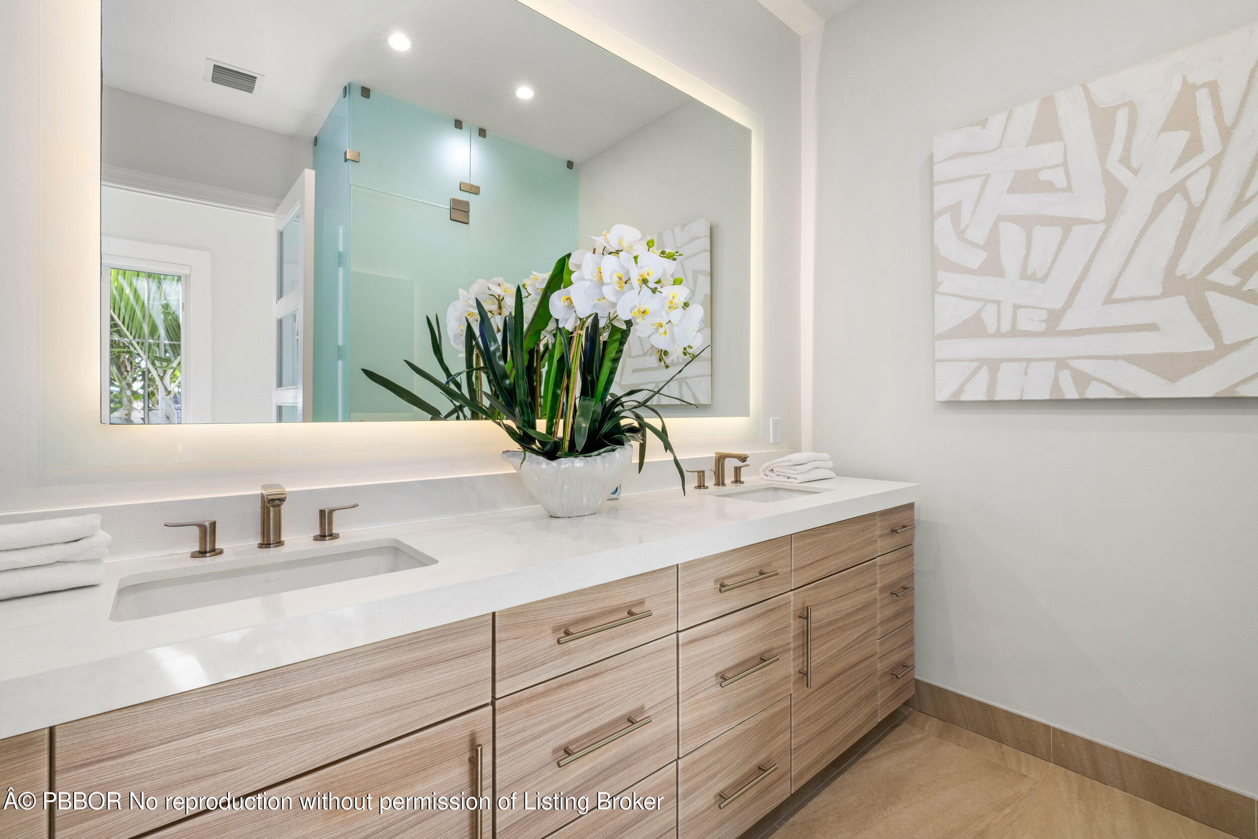 17 Adams Road, Unit 17 Ocean Ridge, FL 33435 - Photo 18 of 40 a bathroom with a granite countertop sink a mirror and a potted plant