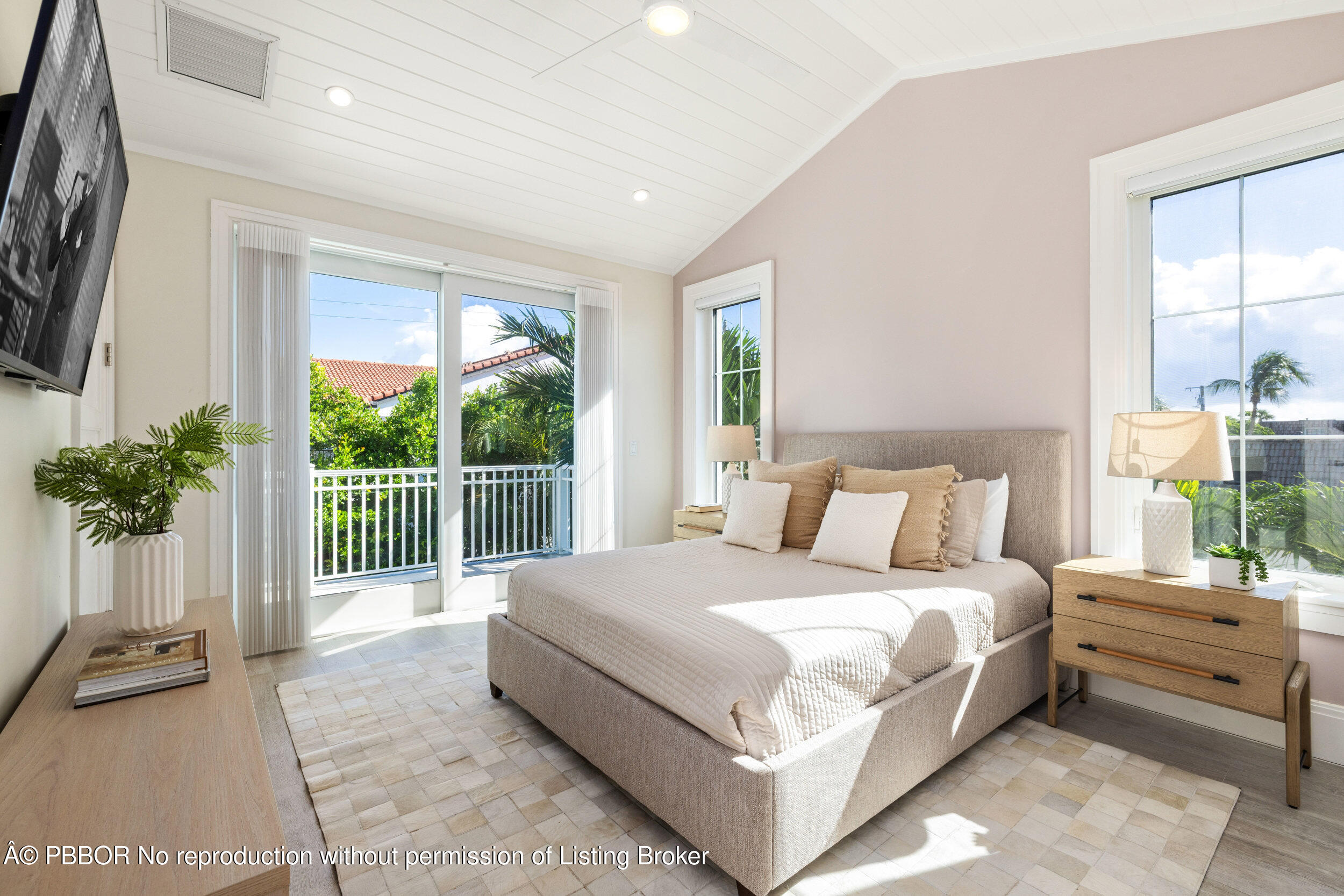 17 Adams Road, Unit 17 Ocean Ridge, FL 33435 - Photo 22 of 40 a bedroom with a bed and a large window