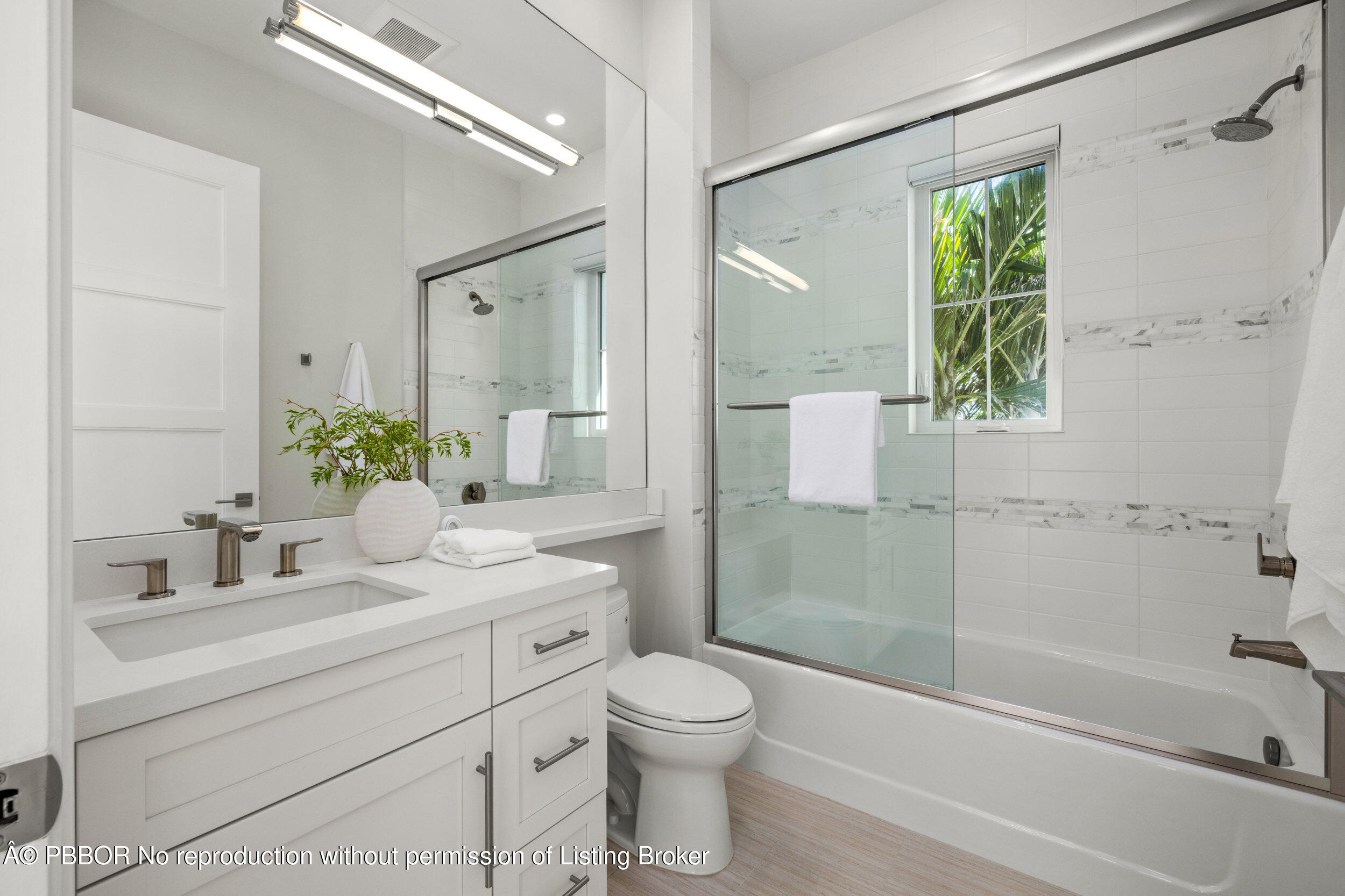 17 Adams Road, Unit 17 Ocean Ridge, FL 33435 - Photo 25 of 40 a bathroom with a sink a toilet and shower