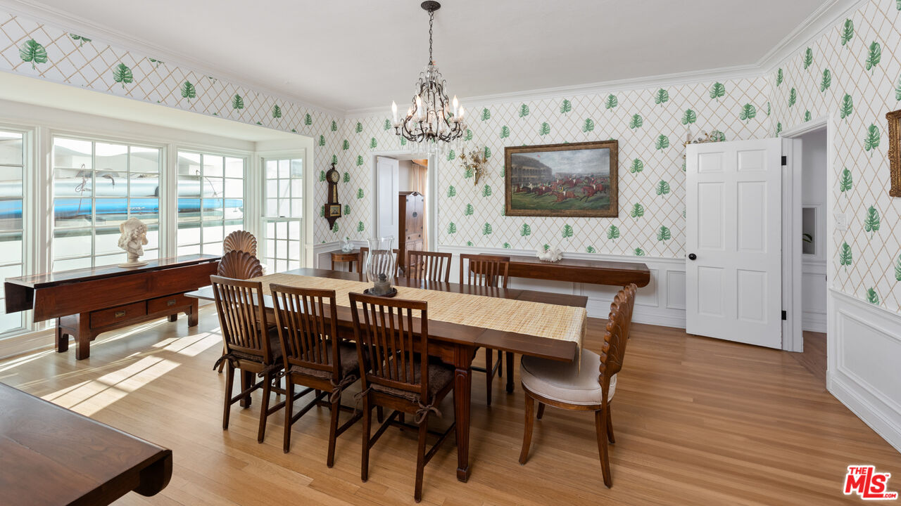 605 Palisades Beach Road Santa Monica, CA 90402 - Photo 7 of 33 a view of a dining room with furniture window and wooden floor