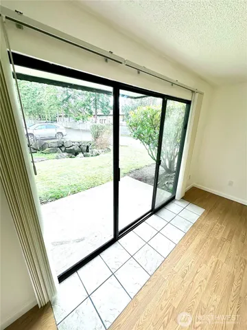 a view of a room with large windows