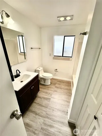 a bathroom with a bathtub and toilet